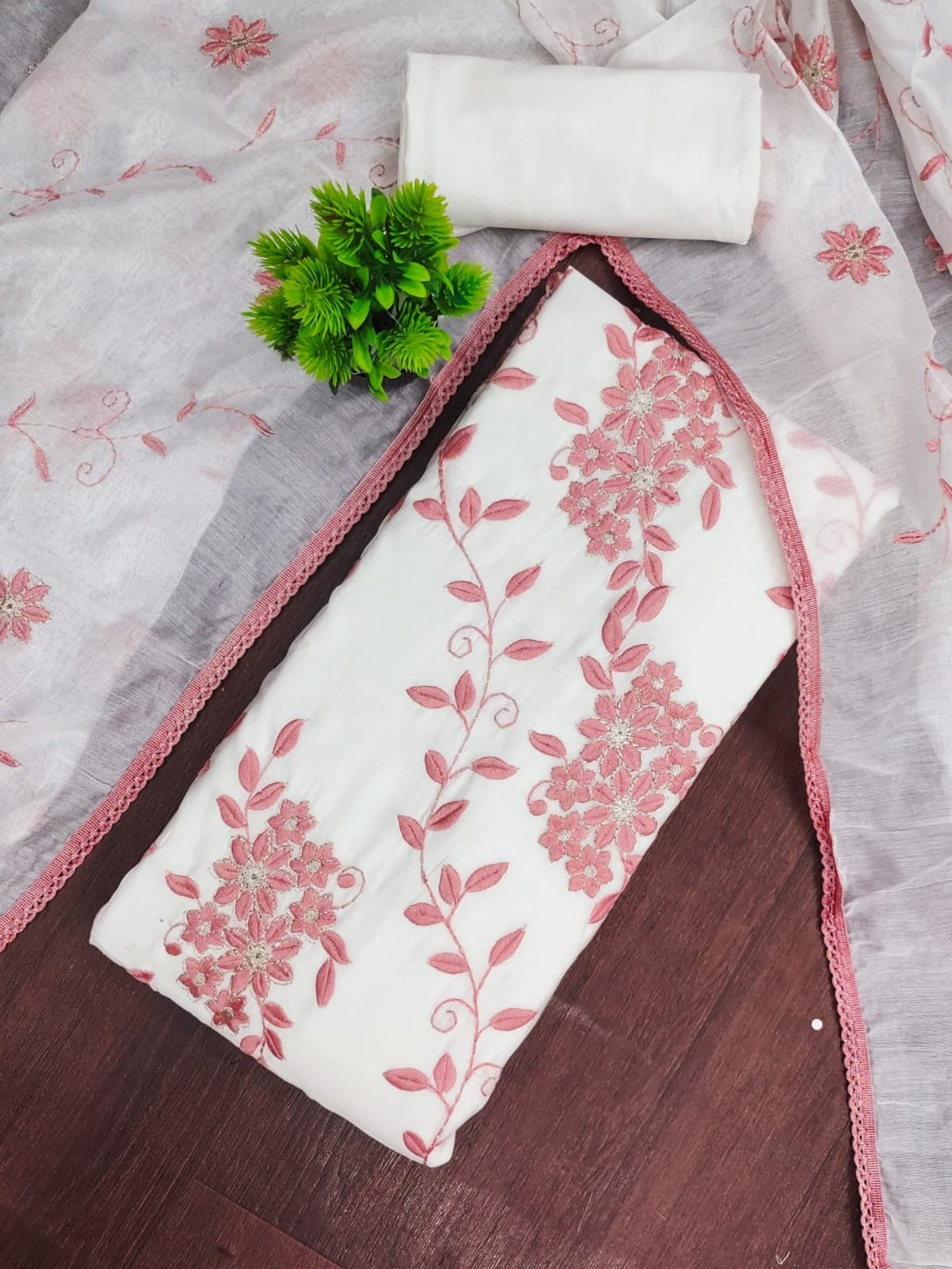 Peachmode Pink Roman Silk Unstitched Dress Material With Contrast Floral Vine Embroidery - Image 1