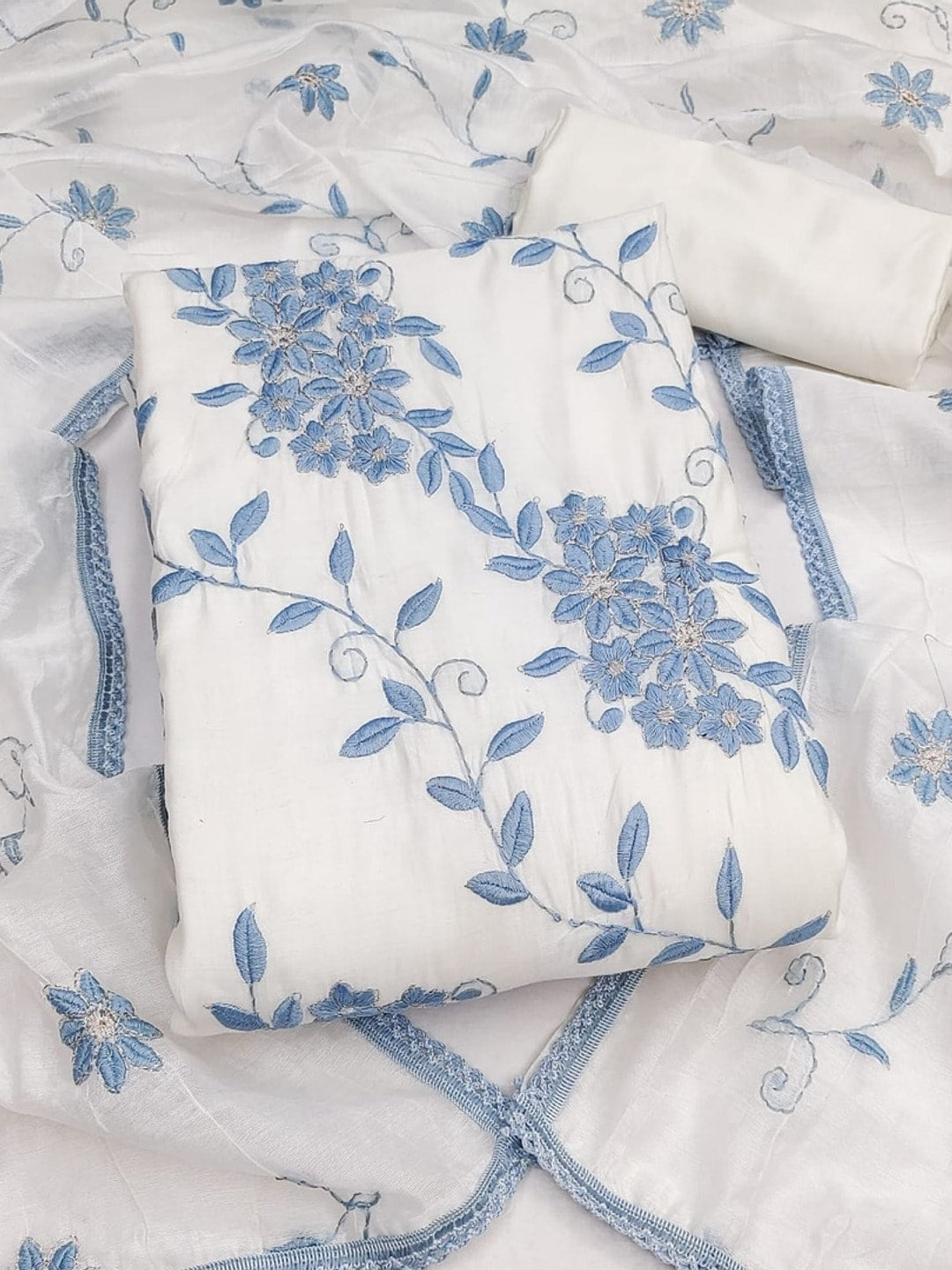 Peachmode Blue Roman Silk Unstitched Dress Material With Contrast Floral Vine Embroidery - Image 4