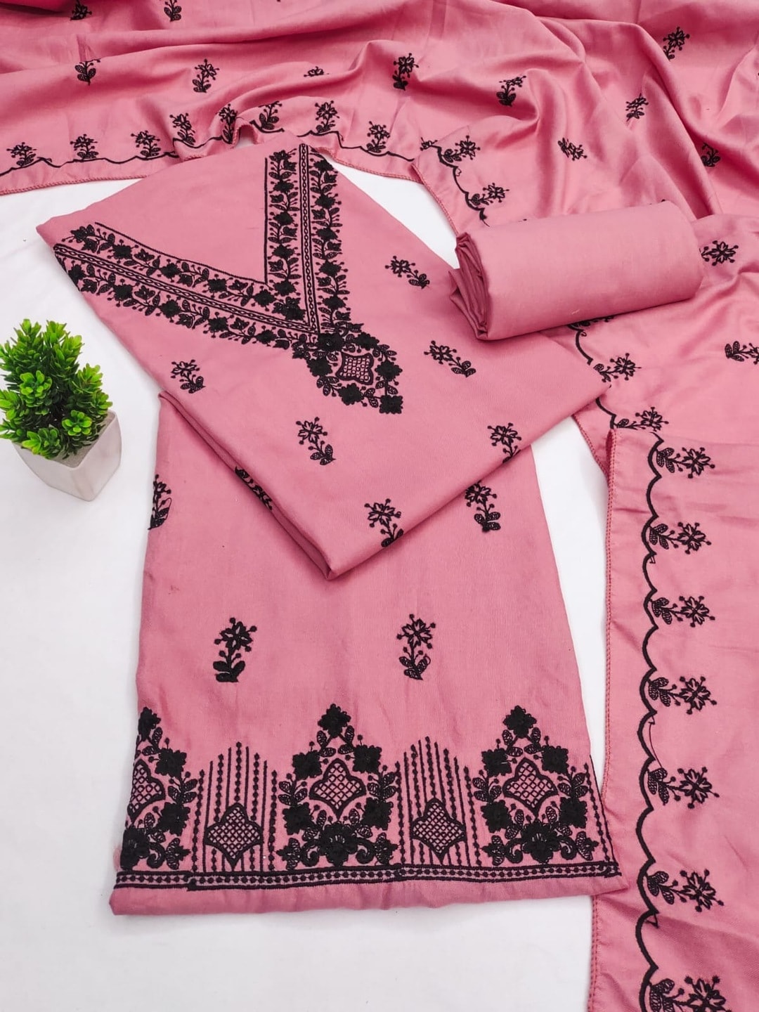 Peachmode Pink Poly Rayon Unstitched Dress Material With Black Thread Embroidered V Neck And Daman Work And Embroidered Dupatta - Image 1
