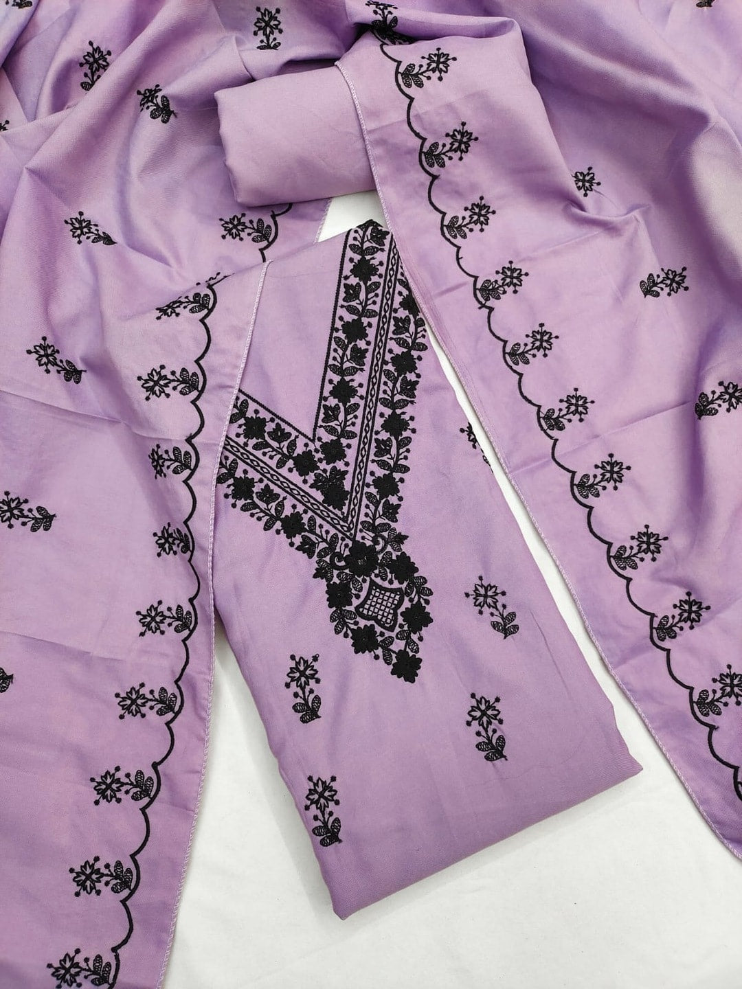 Peachmode Lavender Poly Rayon Unstitched Dress Material With Black Thread Embroidered V Neck And Daman Work And Embroidered Dupatta - Image 1