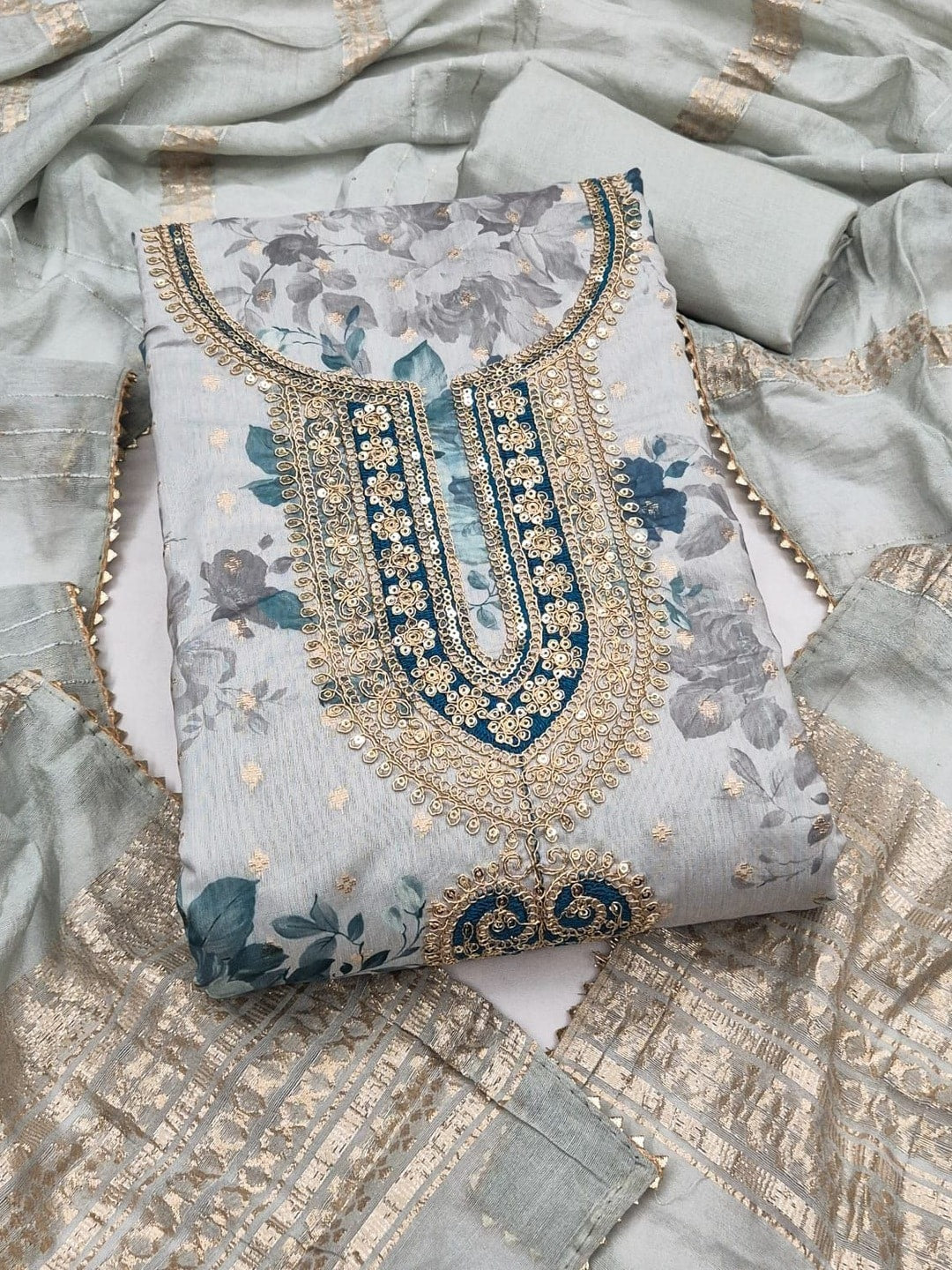 Peachmode Powder Blue Chanderi Jacquard Unstitched Dress Material With Floral Print And Embroidered U Neck And Lace Edge Dupatta - Image 1