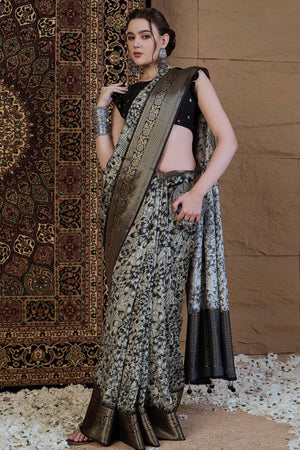 Off White Viscose Saree with All-Over Floral Art and Ornate Zari Woven Border