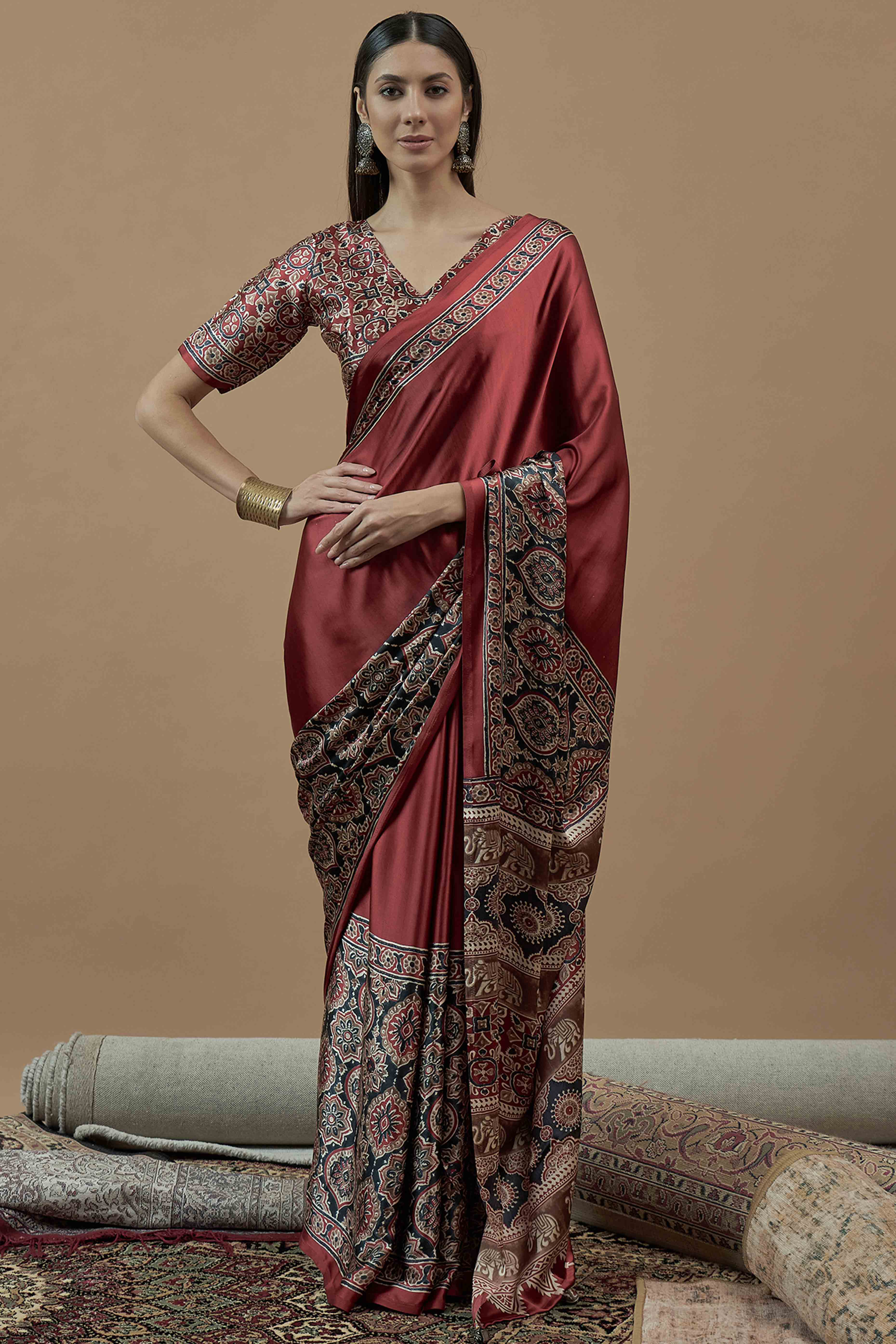 Rust Floral Ajrakh Printed Satin Saree With Tassels