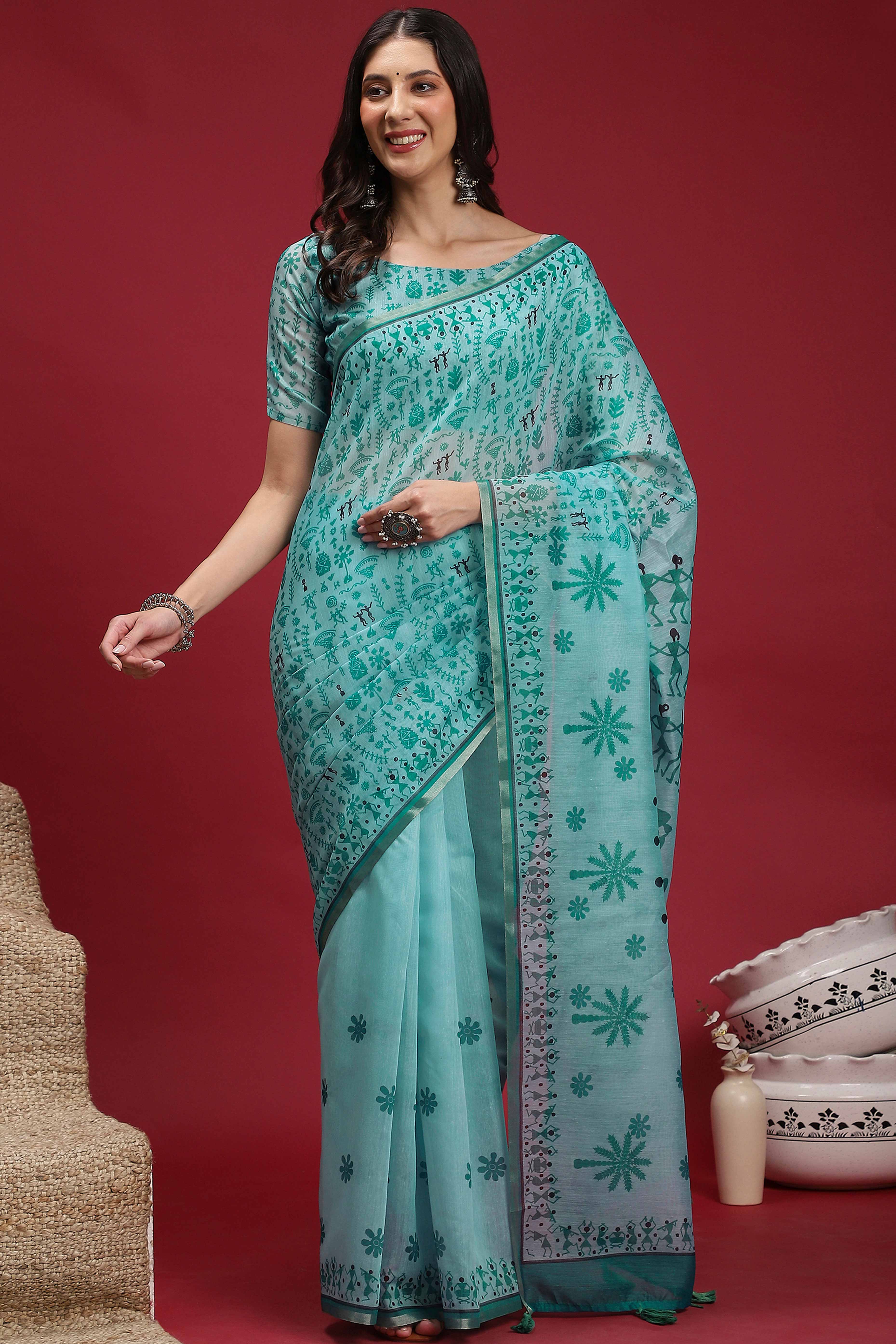 Turquoise Linen Cotton Saree Featuring Traditional Warli Prints & Tassel Pallu
