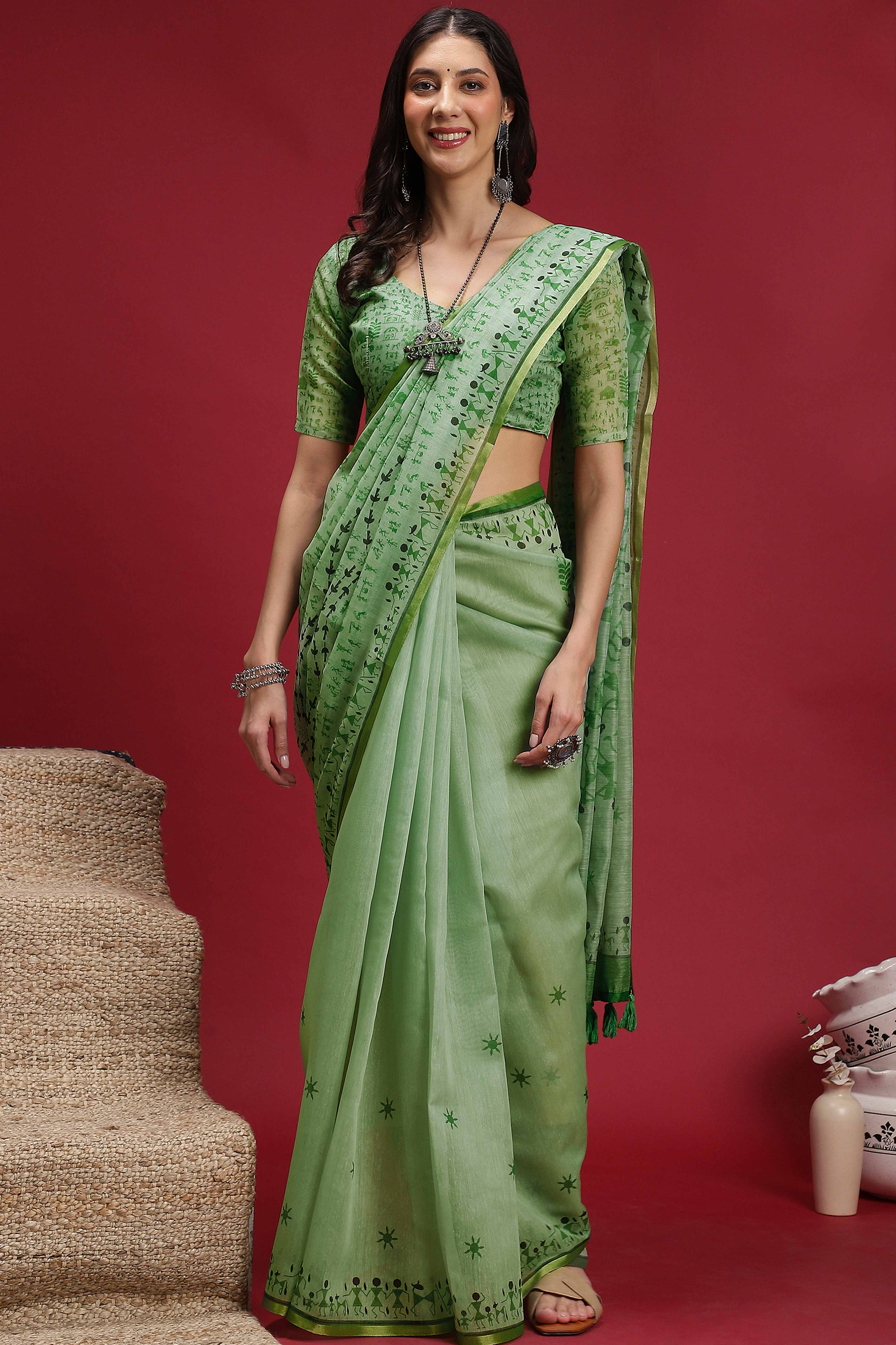 Green Linen Cotton Saree Featuring Traditional Warli Prints & Tassel Pallu