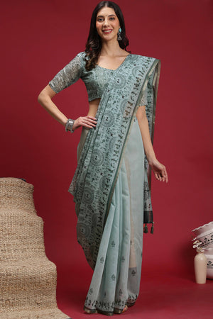 Pastel Blue Linen Cotton Saree Featuring Traditional Warli Prints & Tassel Pallu