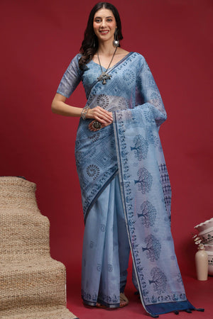 Powder Blue Linen Cotton Saree Featuring Traditional Warli Prints & Tassel Pallu