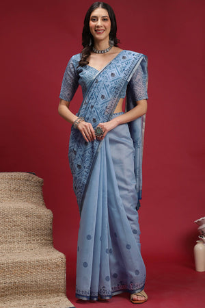 Light Blue Linen Cotton Saree Featuring Traditional Warli Prints & Tassel Pallu