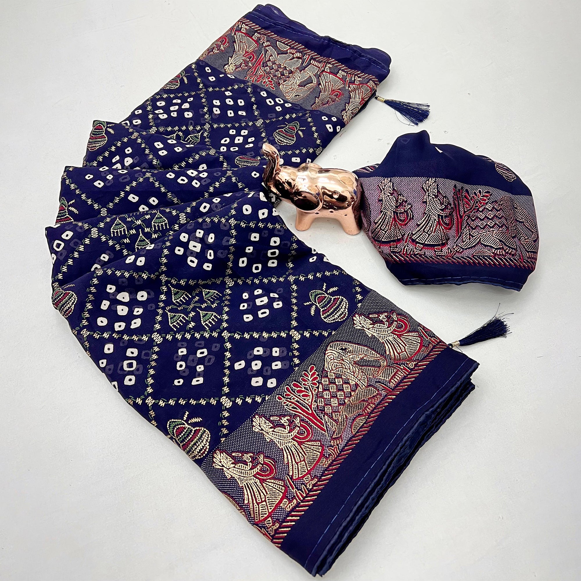 Elegant Navy Blue Bandhani Foil Printed Georgette Saree Highlighted With Soft Tassel Pallu