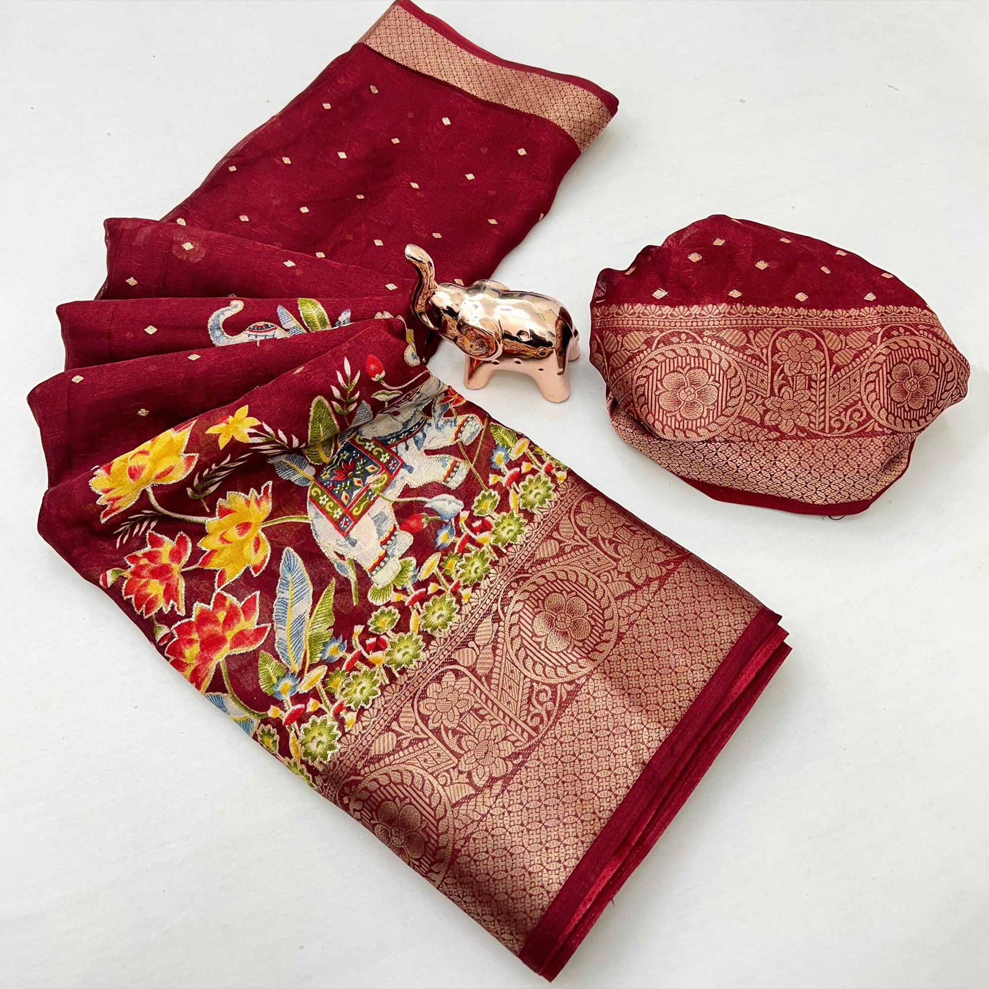 Elegant Maroon Elephant & Floral Printed Georgette Saree Accented With Gleaming Weaving Zari Border