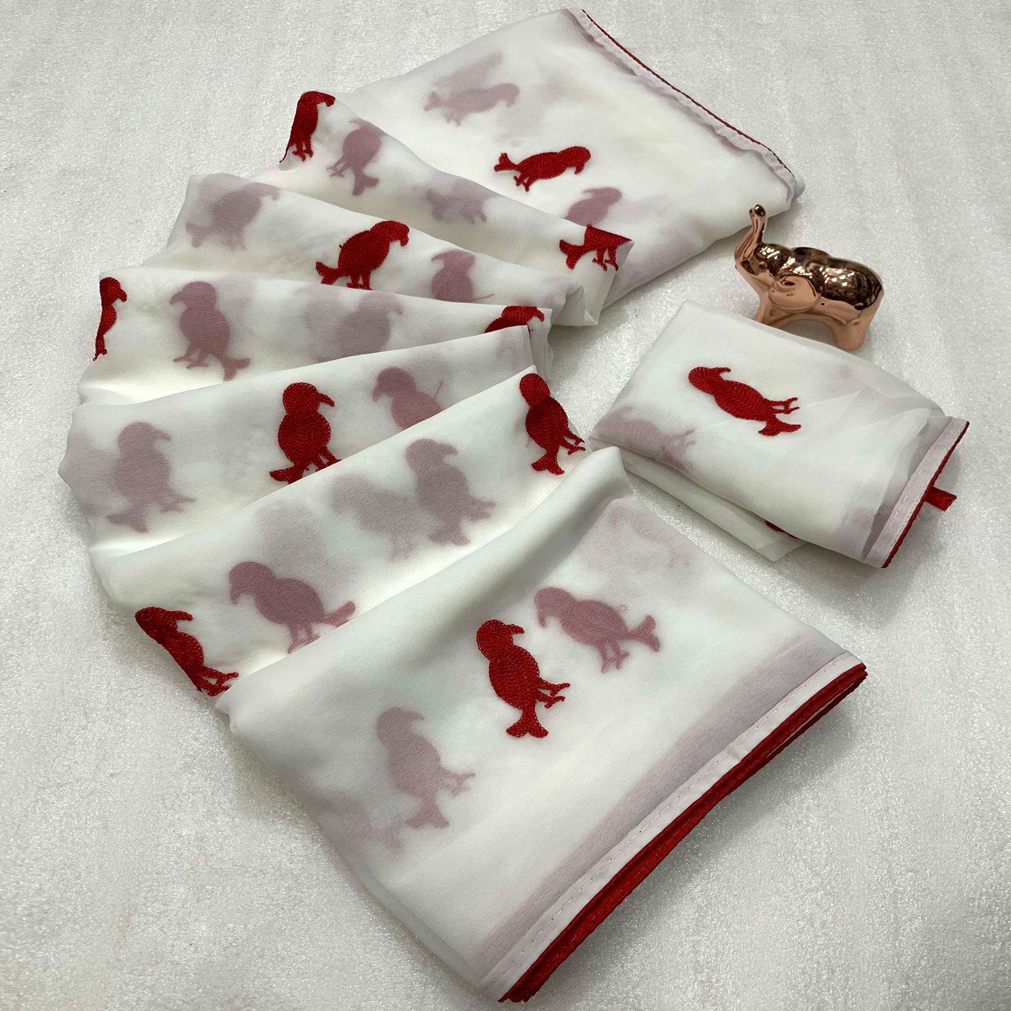 White Georgette Saree Adorned With Elegant Bird Embroidery.