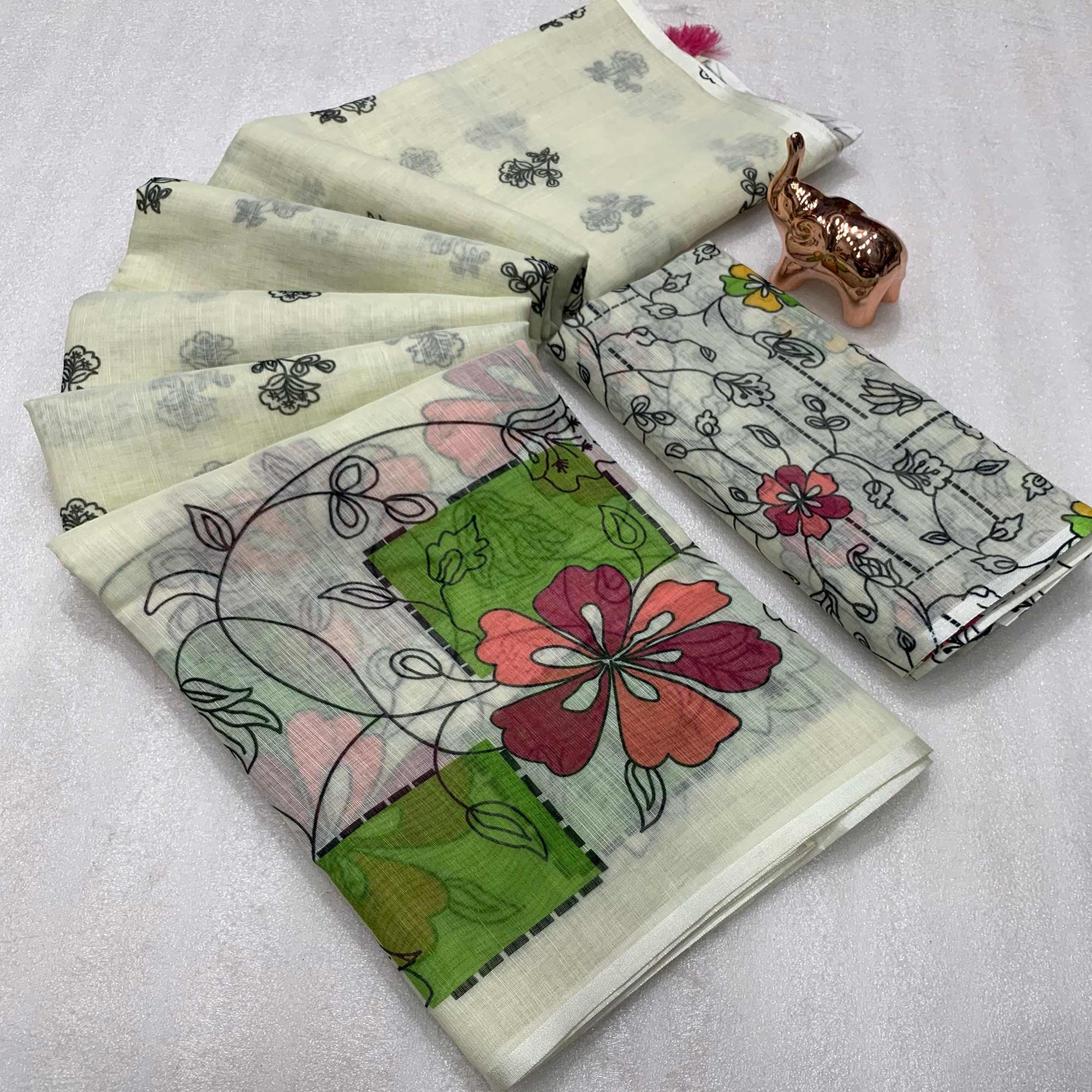 Light Cream Floral Printed Linen Saree With Elegant Tassel Border