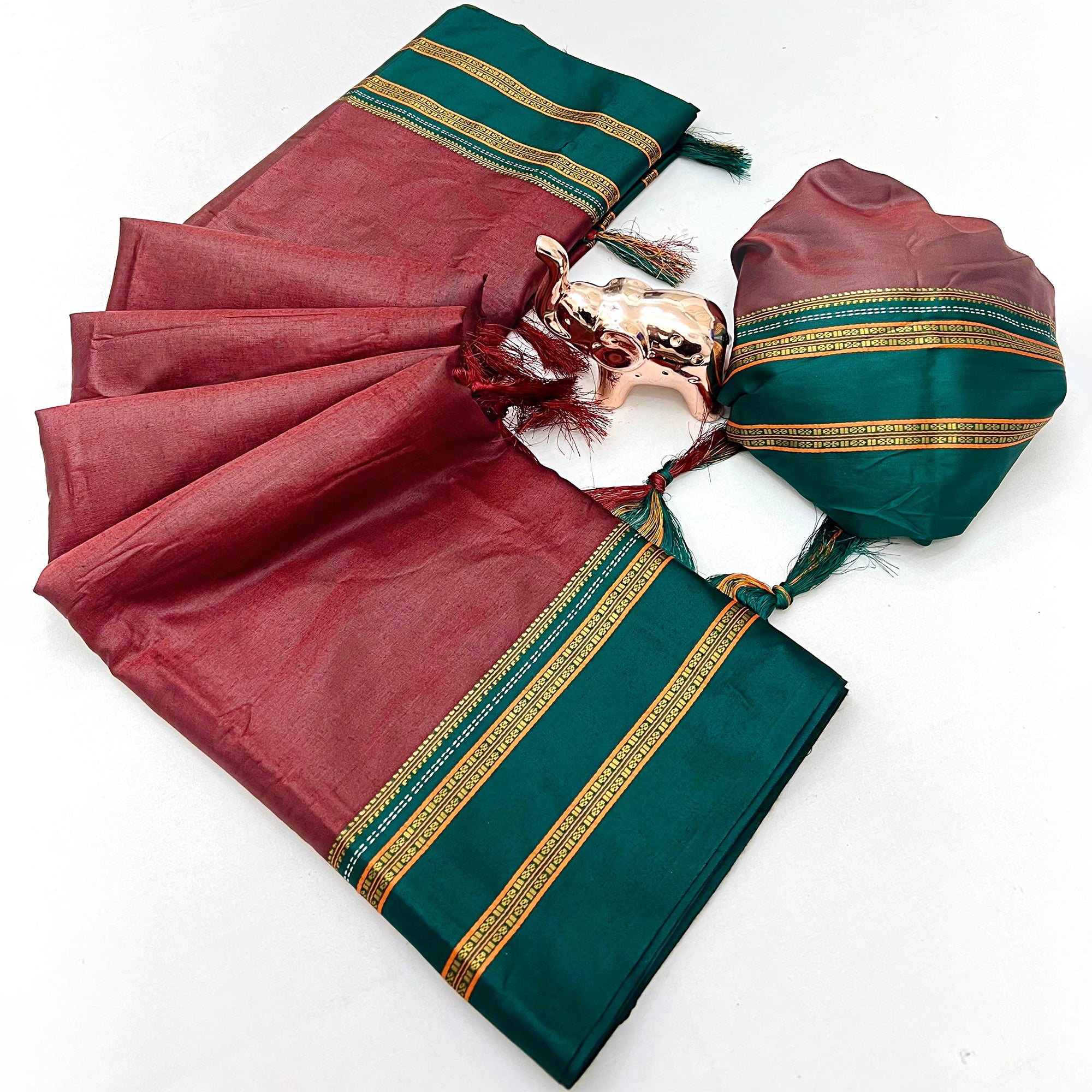 Classic Maroon Solid Weaving Pure Silk Saree Accented With Woven Striped Pallu & Tassel Finish