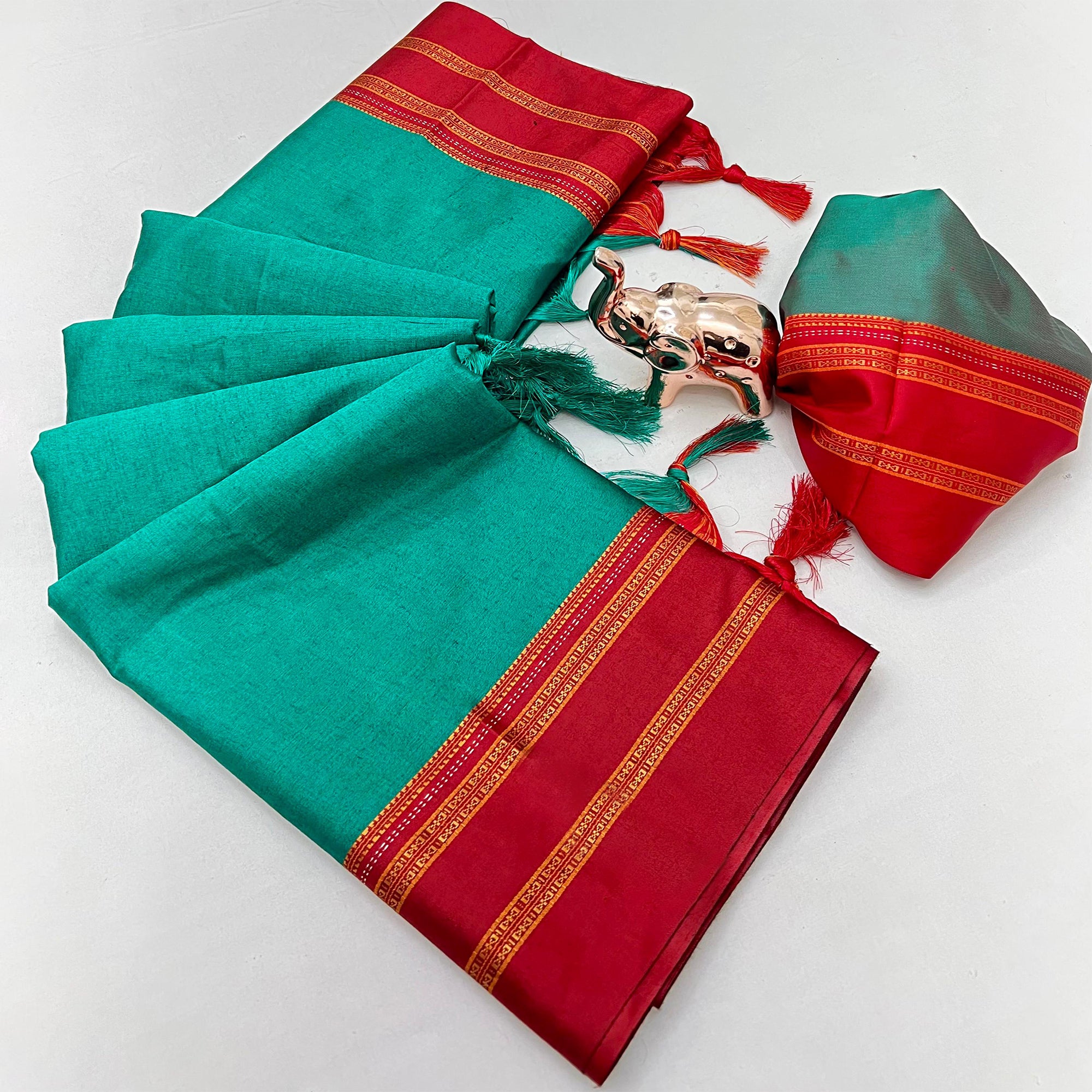 Classic Teal Green Solid Weaving Pure Silk Saree Accented With Woven Striped Pallu & Tassel Finish