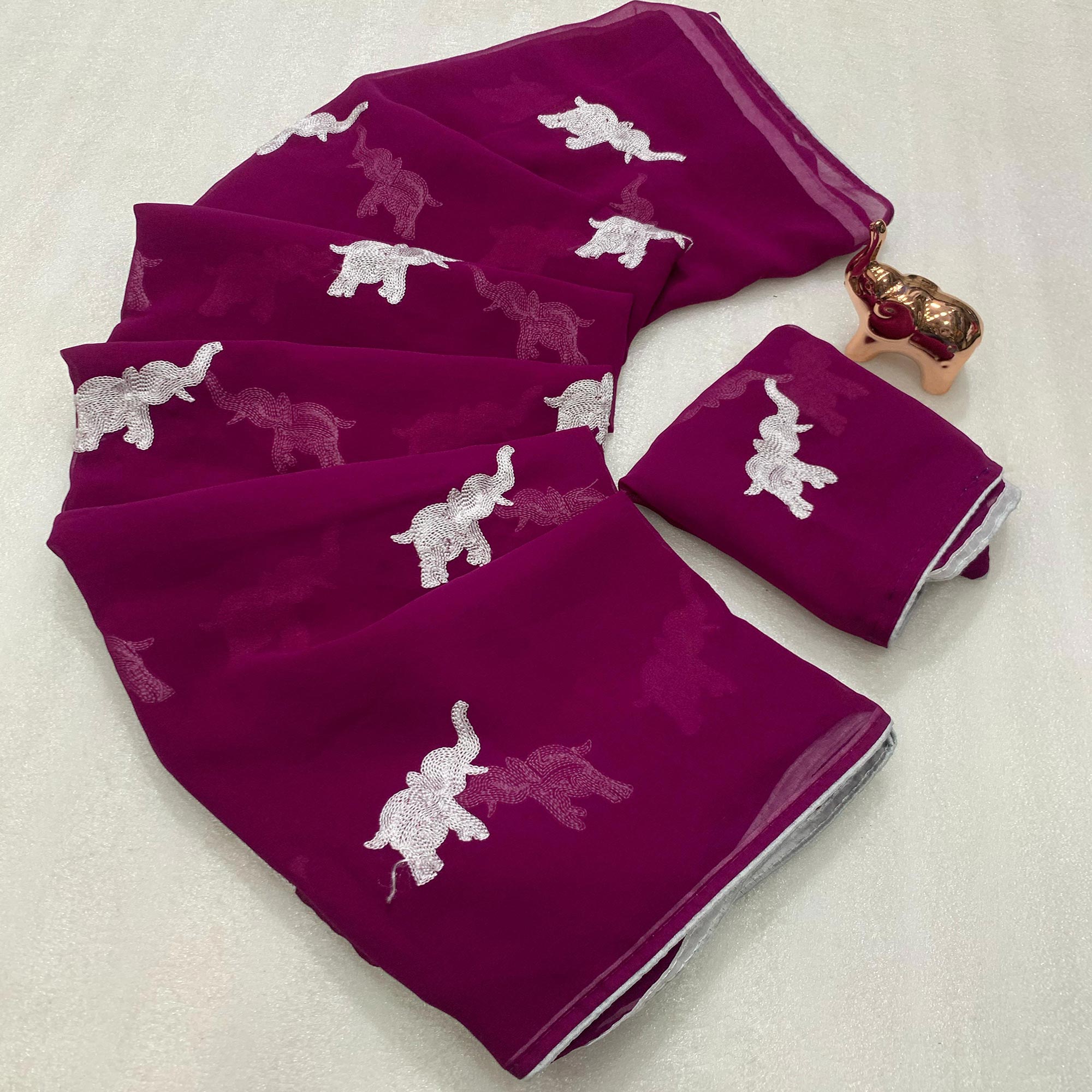 Dark Purple Georgette Saree Featuring Exquisite Elephant Embroidery