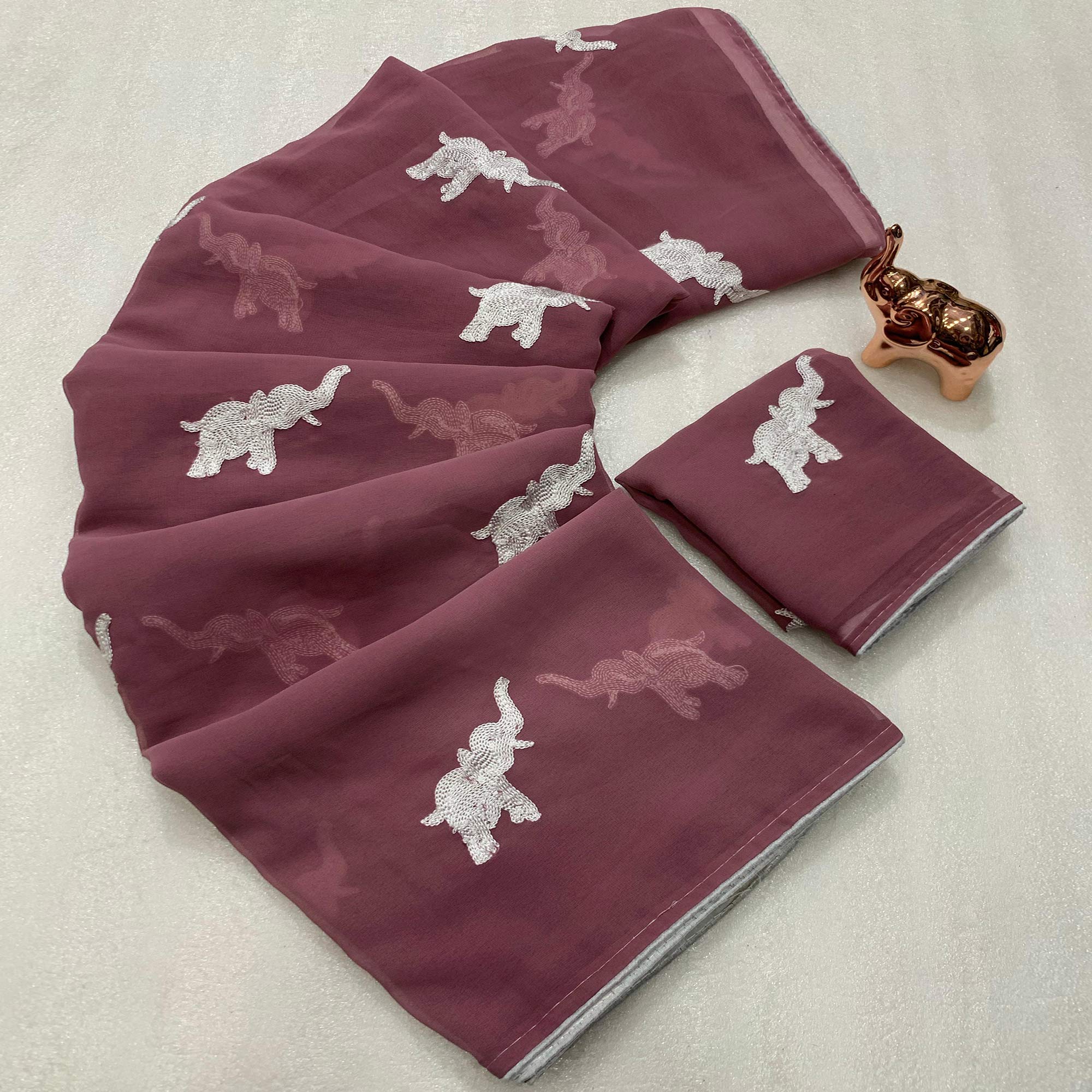 Mauve Georgette Saree Featuring Exquisite Elephant Embroidery