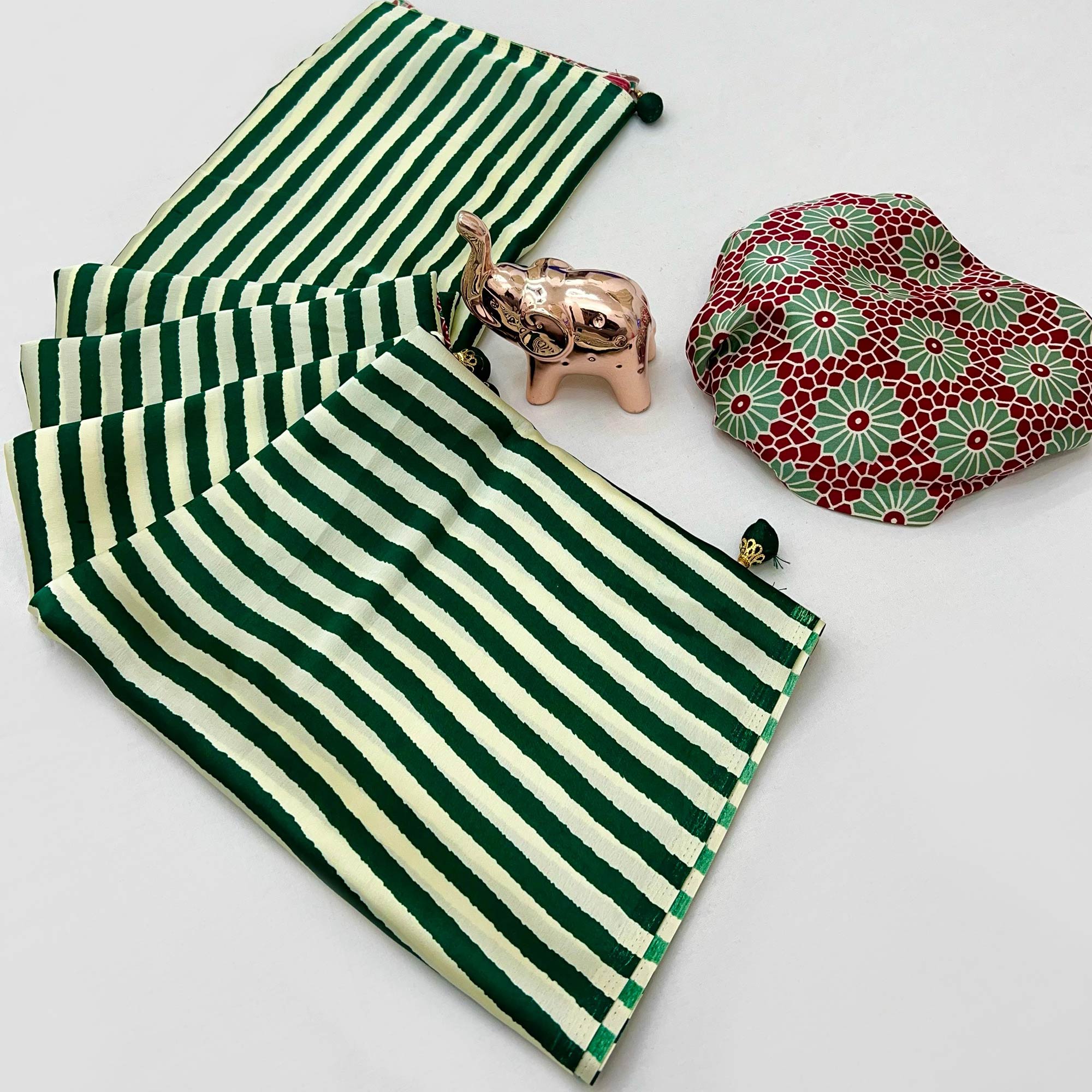 Luxe Partywear Saree in Green Satin with Modern Striped Print and Flowing Drape