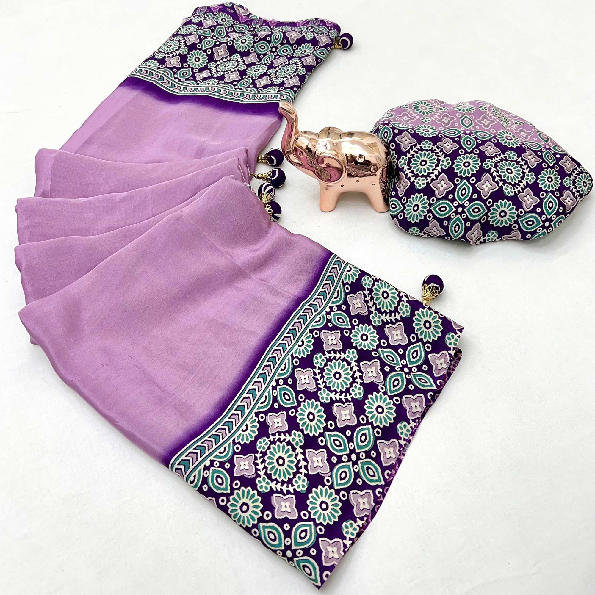 Lavender Solid Satin Saree Featuring Bold Ajrakh Print and Tassel Accented Pallu