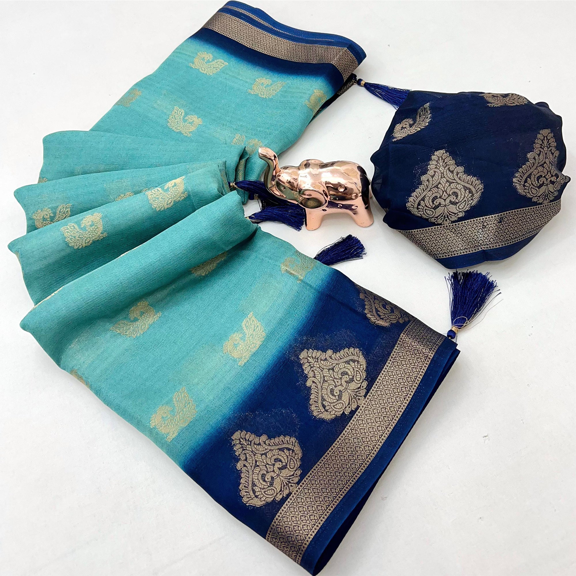 Elegant Blue Peacock Pattern Zari Weaving Georgette Saree With Tassel Pallu