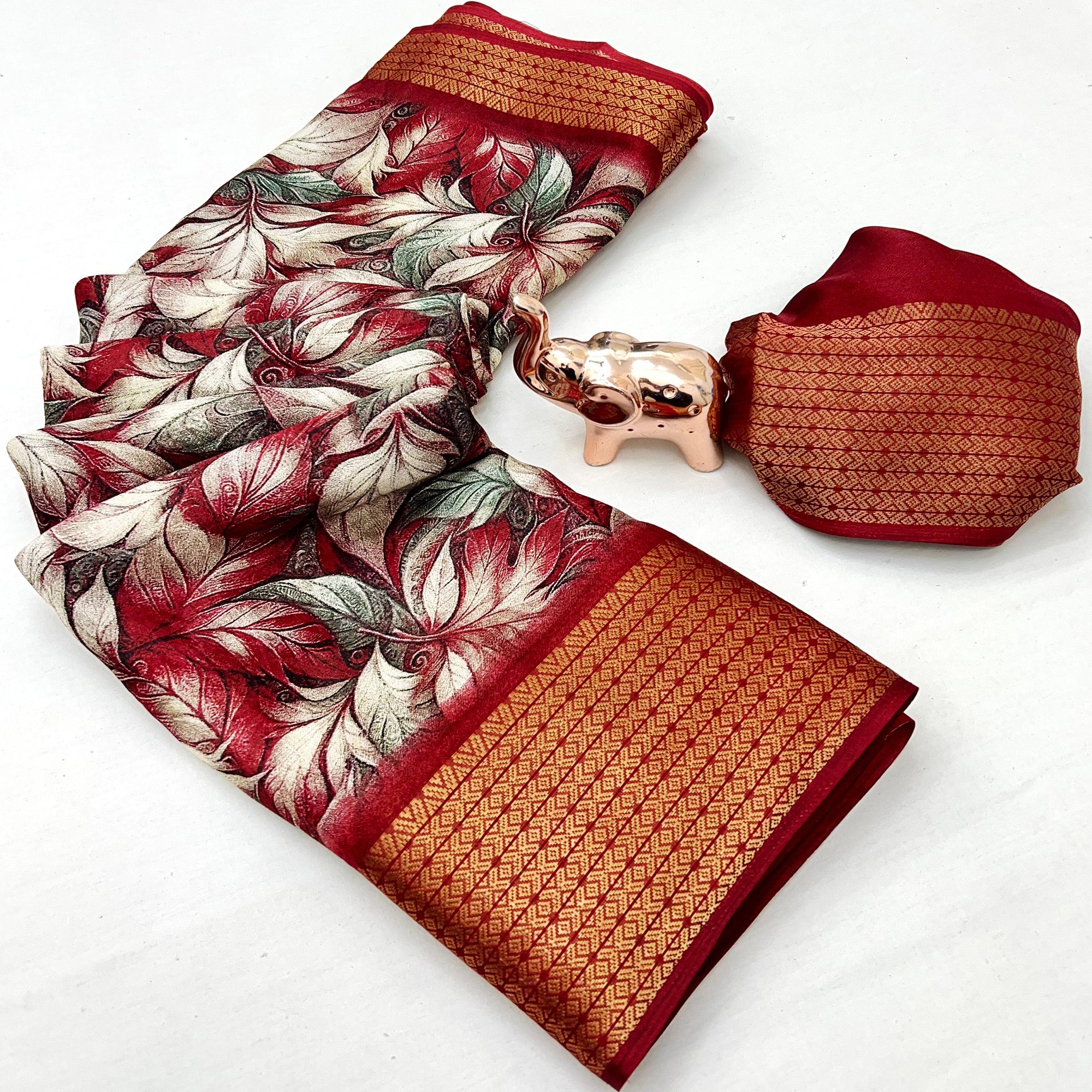 Cherry Red Leaf Printed Dola Silk Marshmallow Saree With Paisley Jaal Pallu & Lustrous Weaving Border