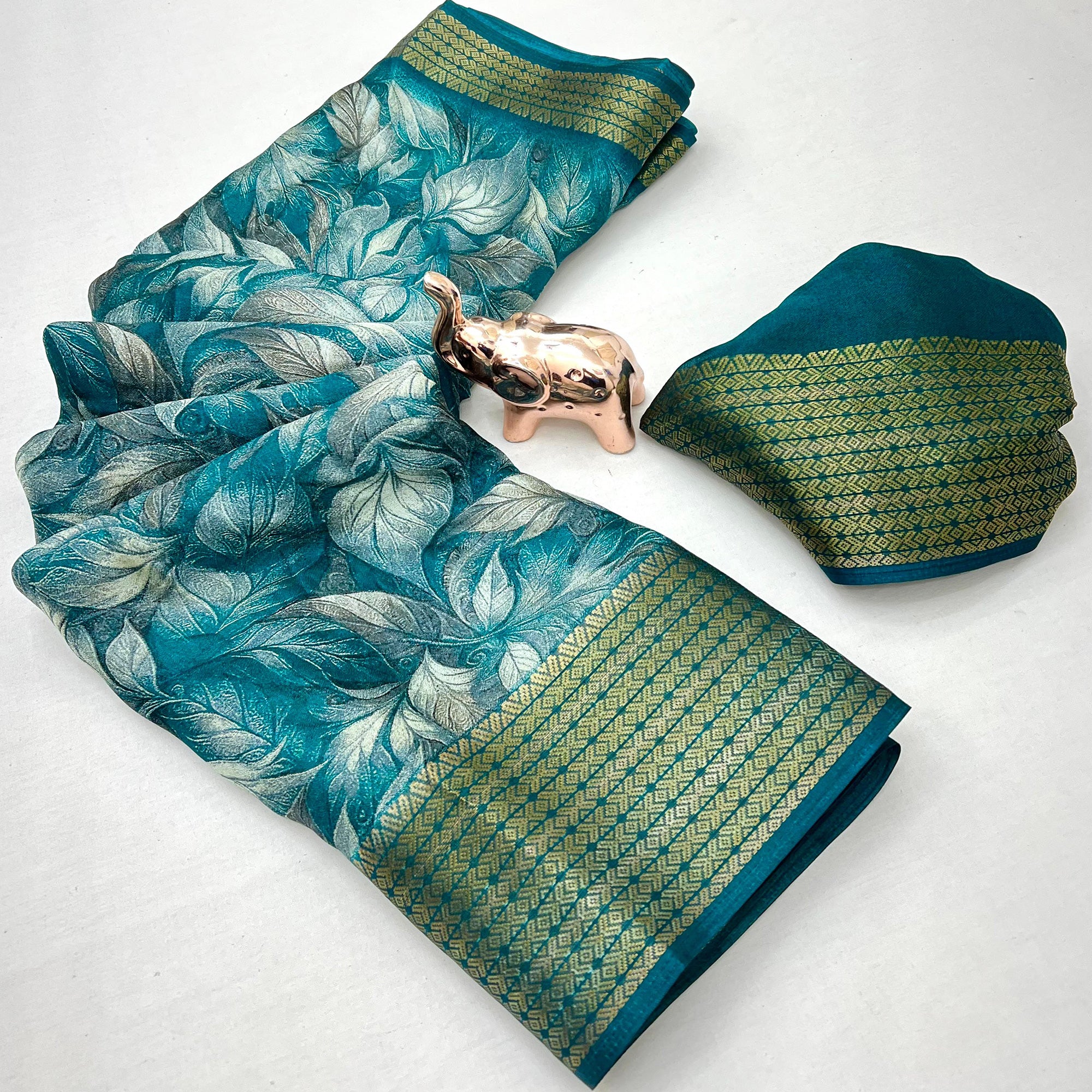 Teal Leaf Printed Dola Silk Marshmallow Saree With Paisley Jaal Pallu & Lustrous Weaving Border