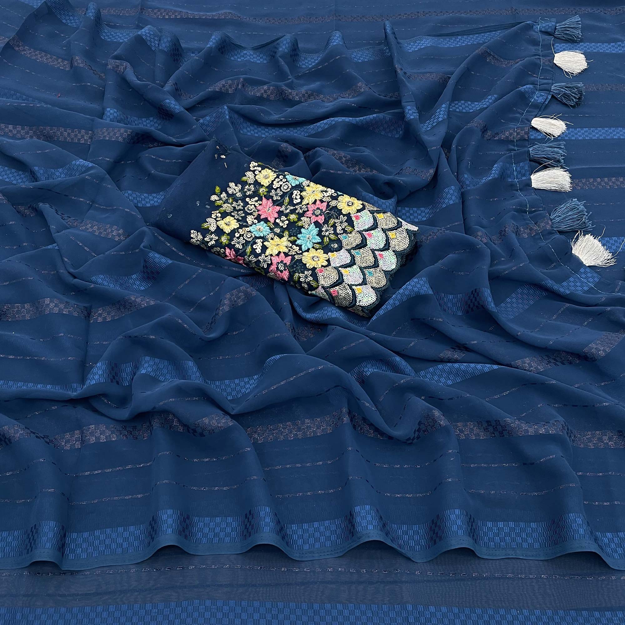 Teal Blue Woven Georgette Saree With Tassels