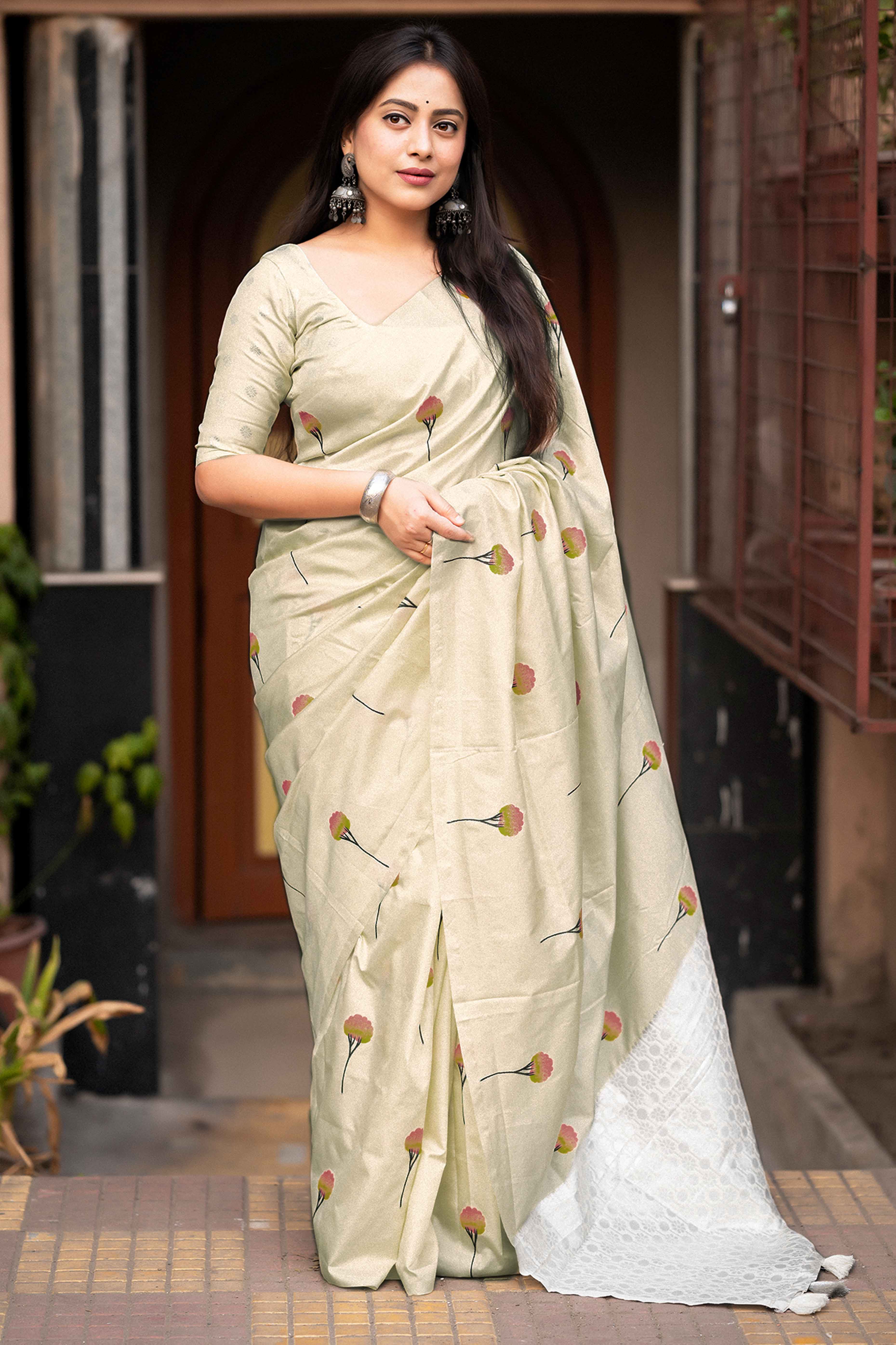 Timeless Cream Banarasi Silk Saree with Floral Zari Weaving & Tassel Border