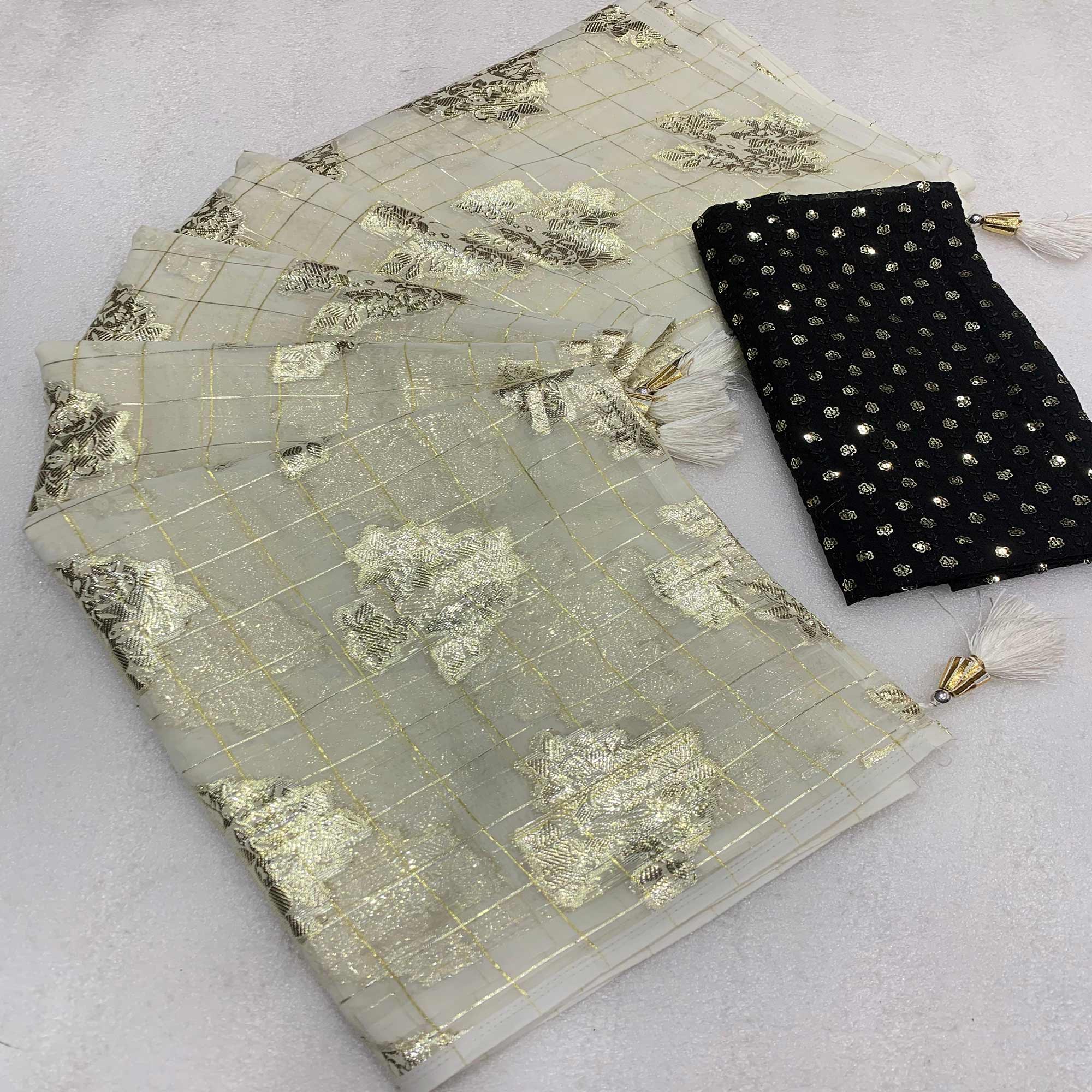 White Floral Woven Georgette Saree With Tassels