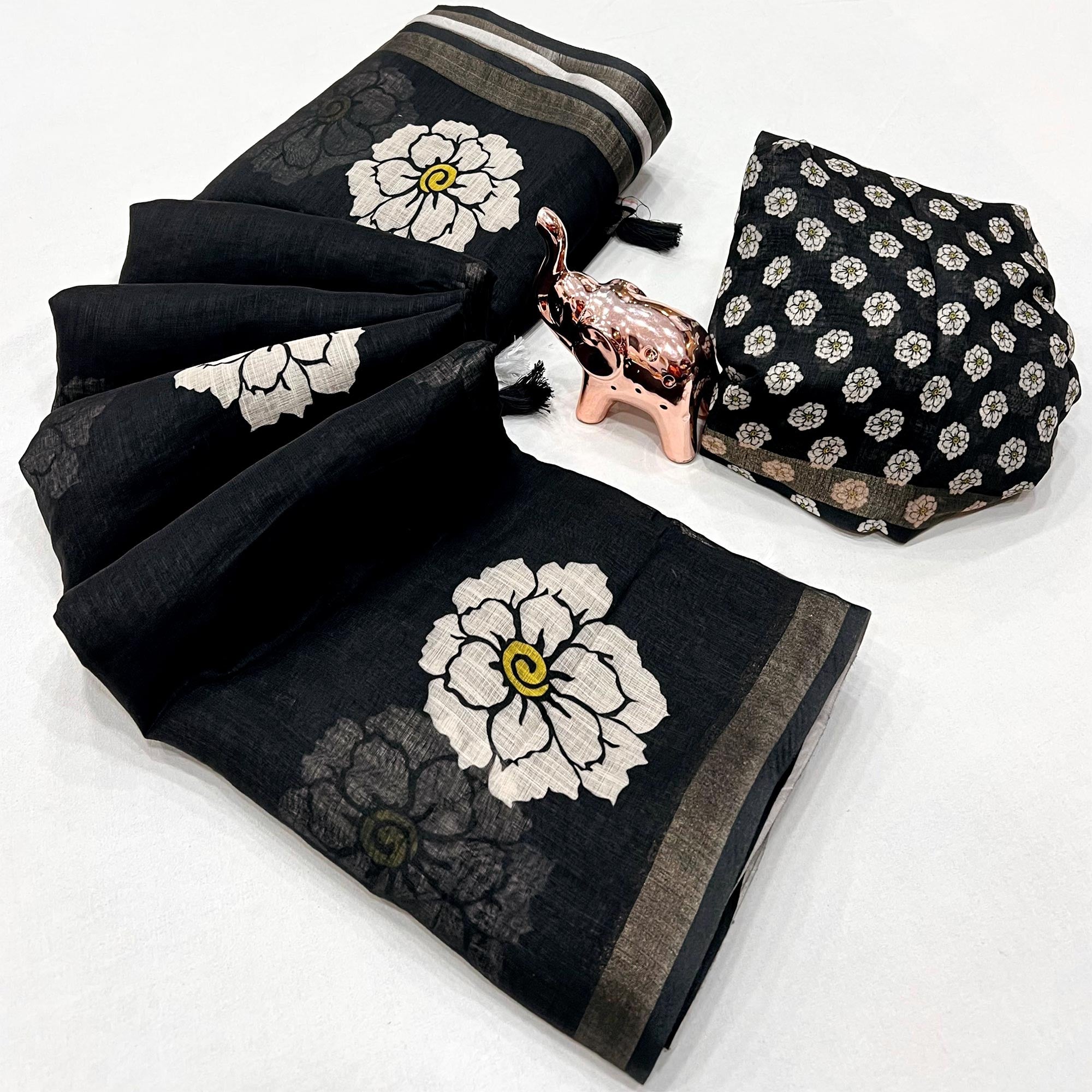 Graceful Black Floral Printed Saree in Linen Silk with Delicate Tassel Accents