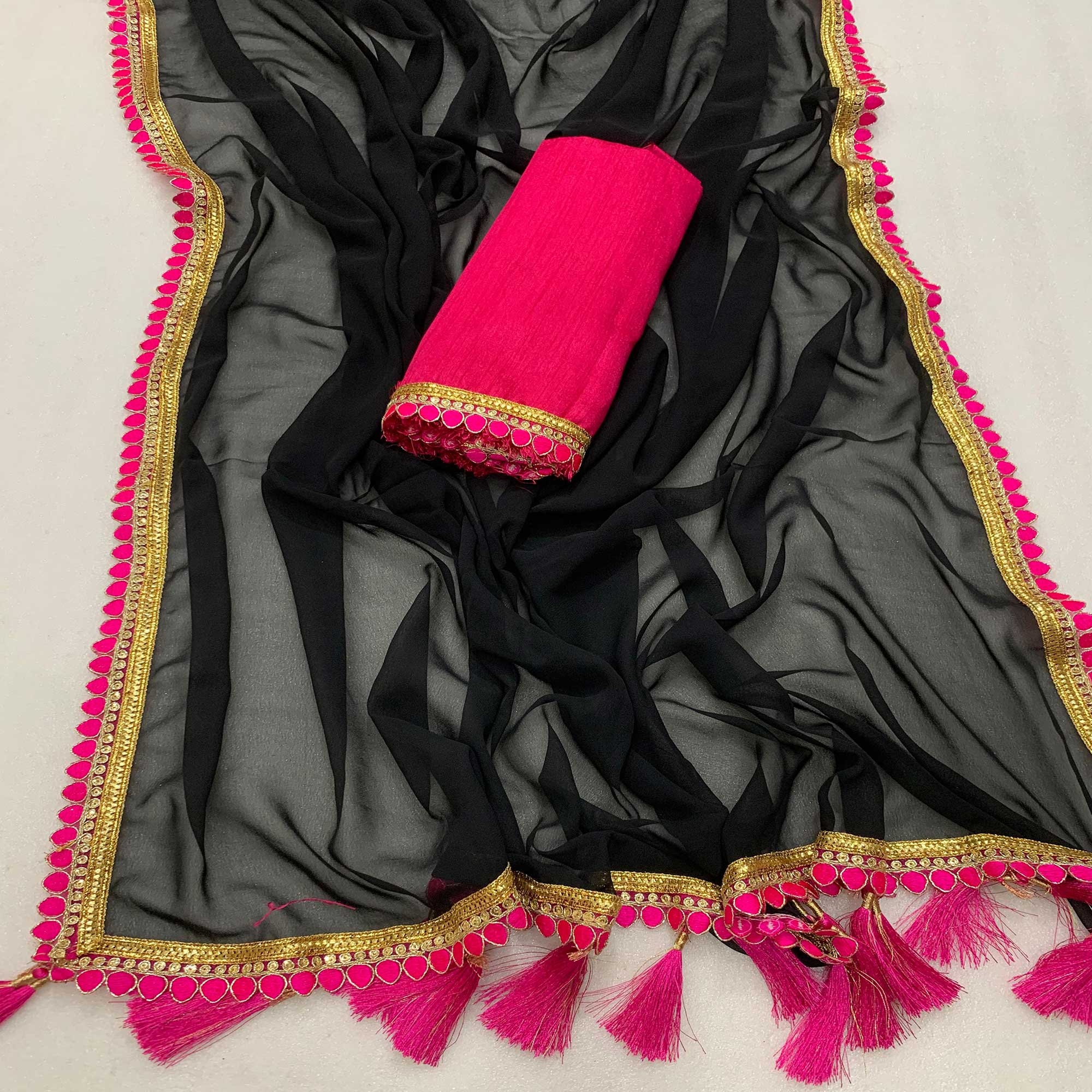 Black Solid Georgette Saree With Embroidered Lace Border Tassels