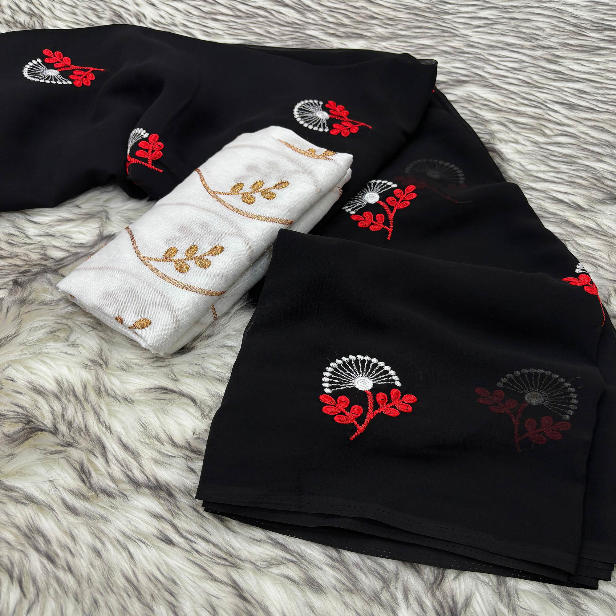 Black Floral Embroidered Georgette Saree With Tassels