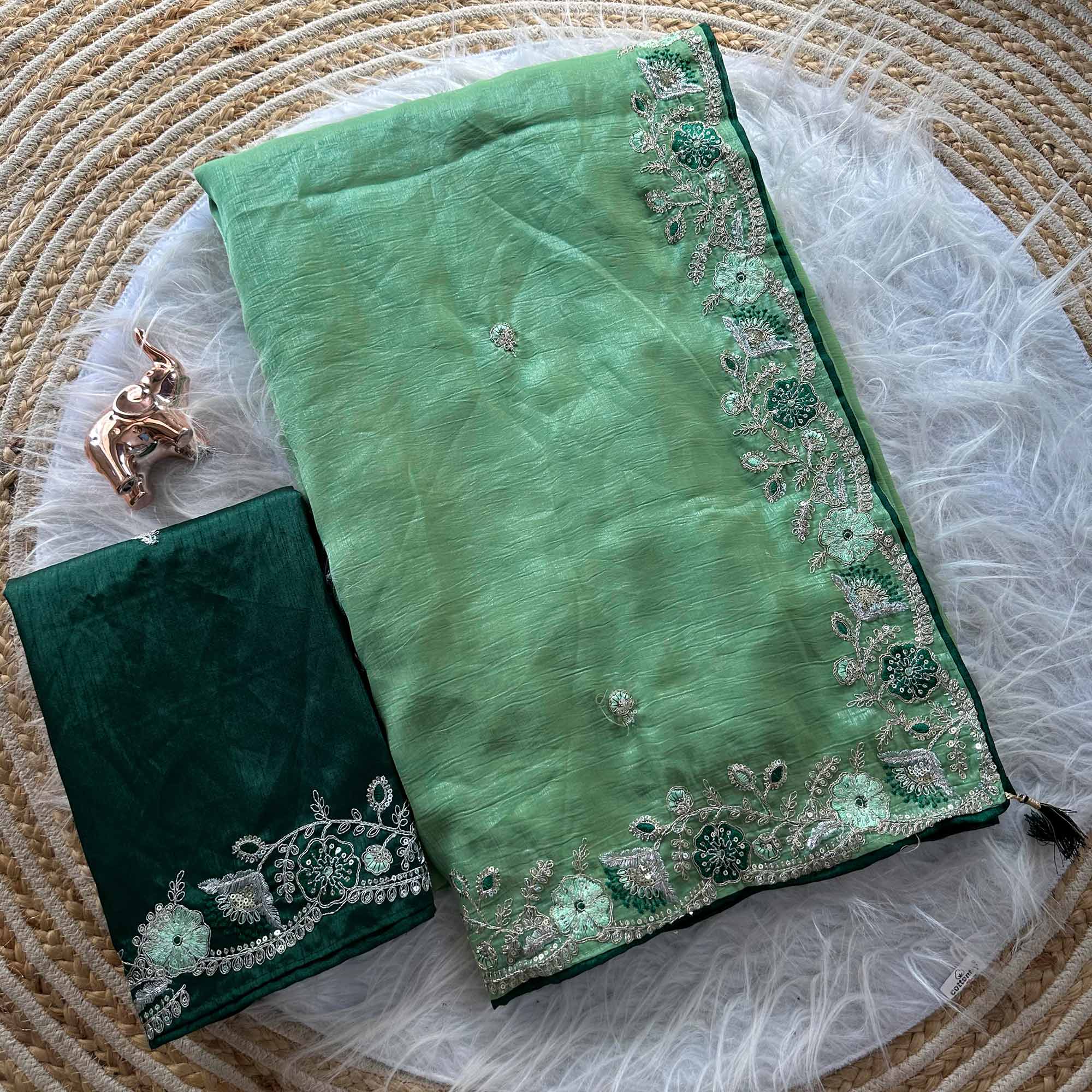Green Pure Silk Saree Showcasing Floral Sequins Embroidery With A Decorative Tassel Pallu