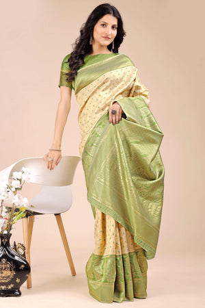 Cream Banarasi Silk Saree Featuring Lustrous Light Green Floral Zari Weaving and a Rich Contrast Border