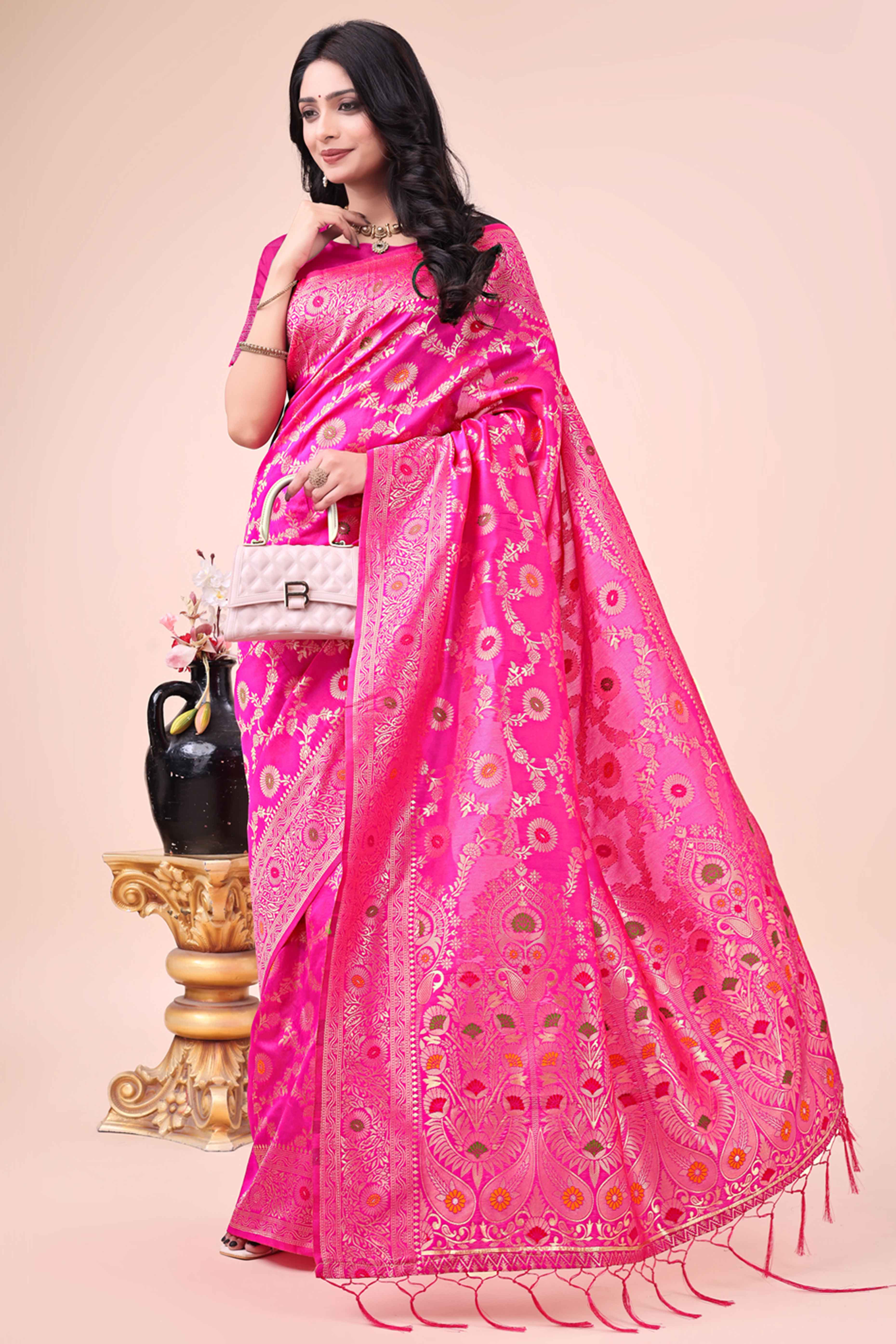Rani Pink Banarasi Silk Saree With Intricate Floral Weave & Elegant Tassel Accents