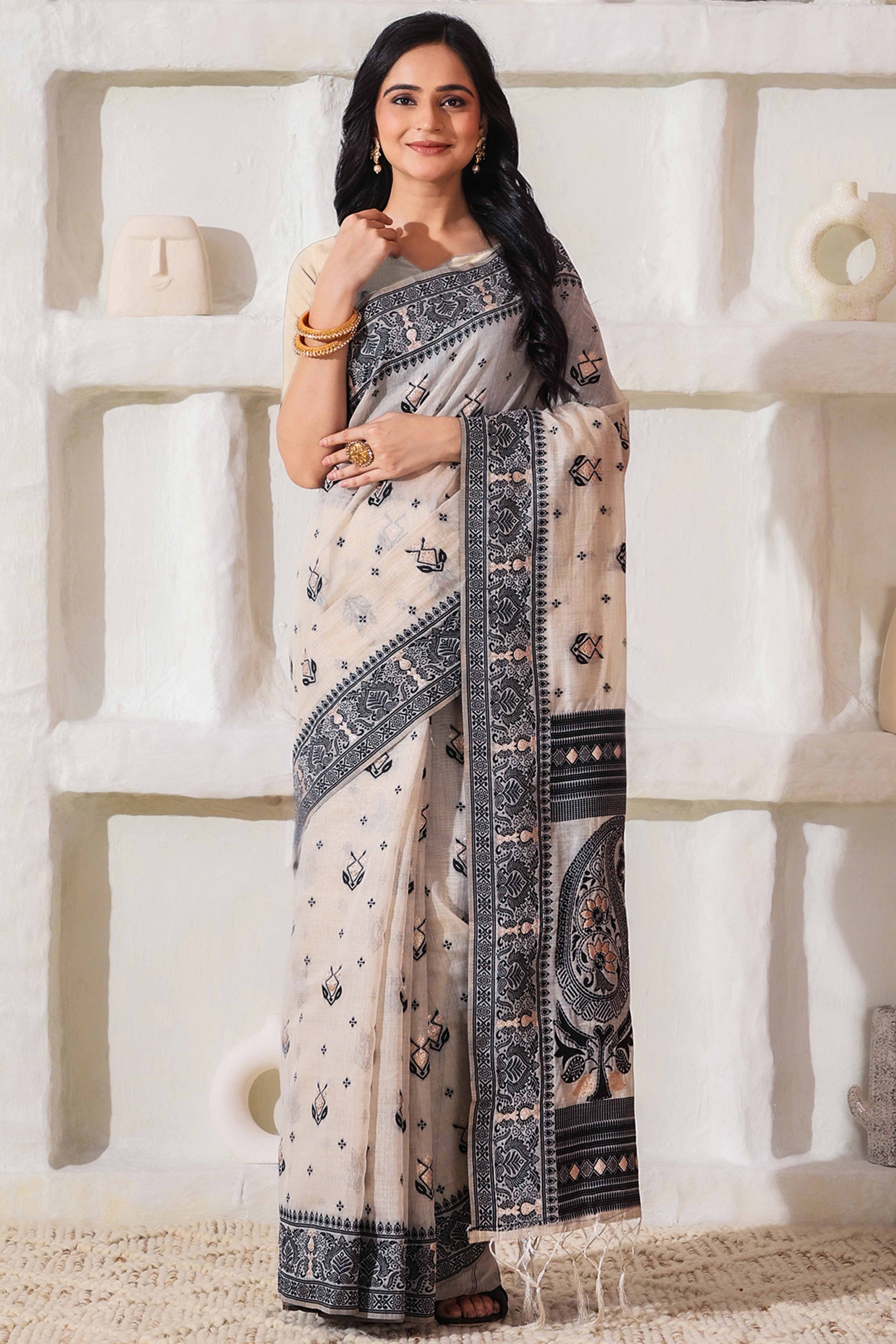 Classic Cream & Black Linen Cotton Saree Featuring Intricate Zari Weaving & Tassel Pallu