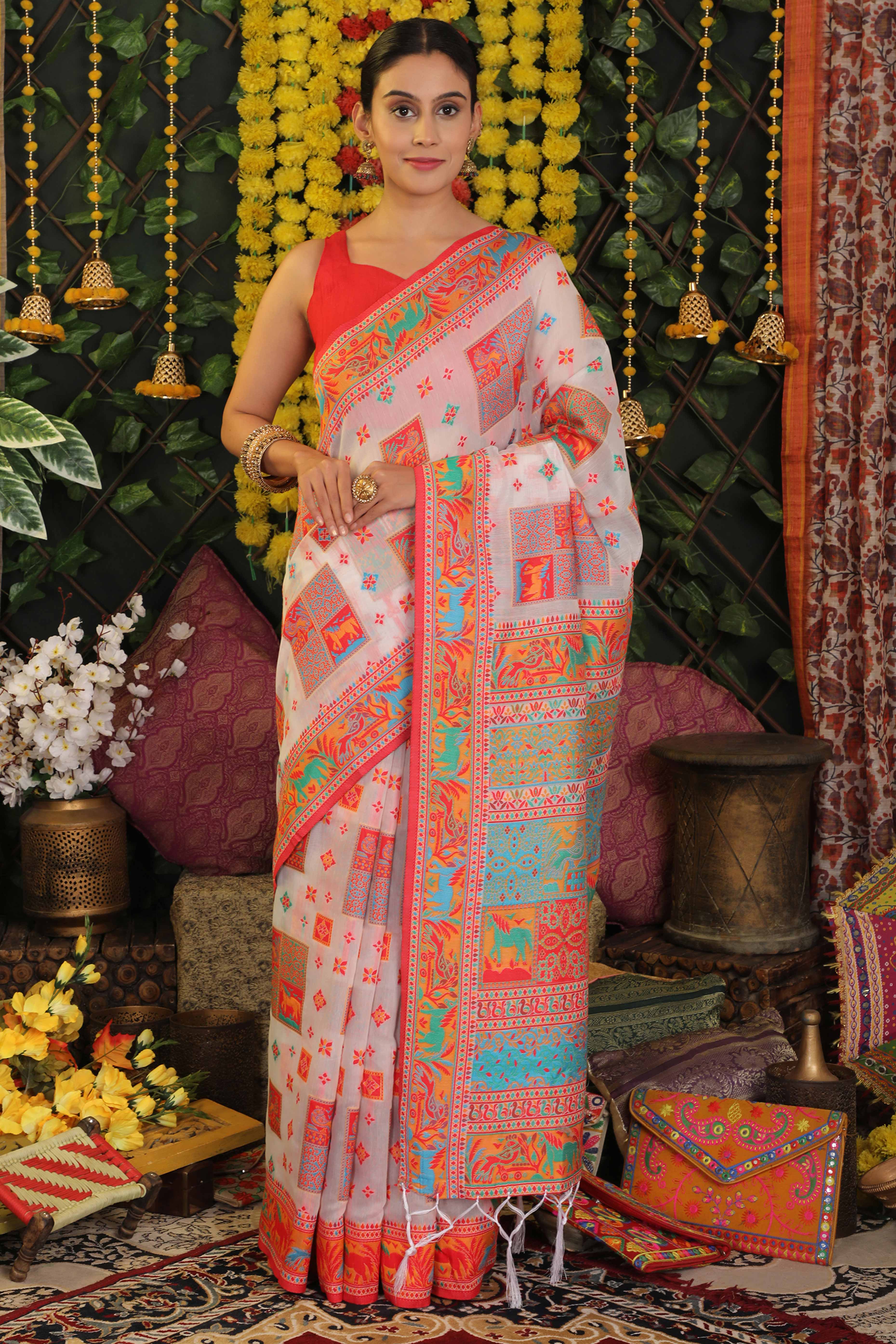 White Linen Cotton Saree Adorned With Floral Zari Weaving & Tassel Pallu