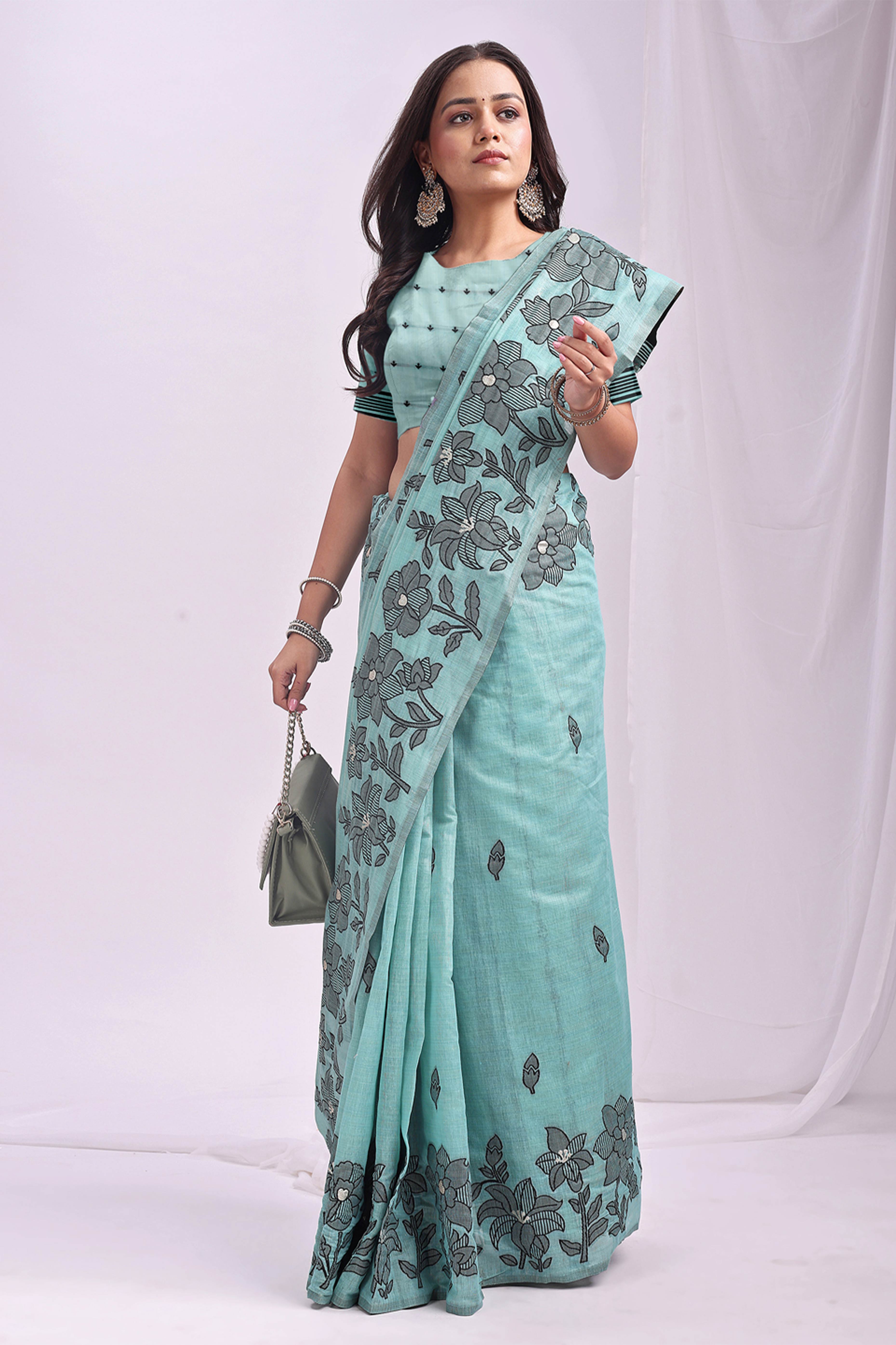 Sea Green Ethnic Saree in a Linen Cotton Blend Adorned with Floral Weave Designs