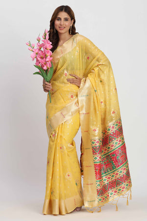 Shimmering Yellow linen Cotton Saree Embellished With Rich Zari Weaving And Tassels Pallu