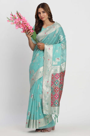 Floral Zari Weaving Brings Regal Beauty To This Turquoise Linen Cotton Saree With Tassel Accents