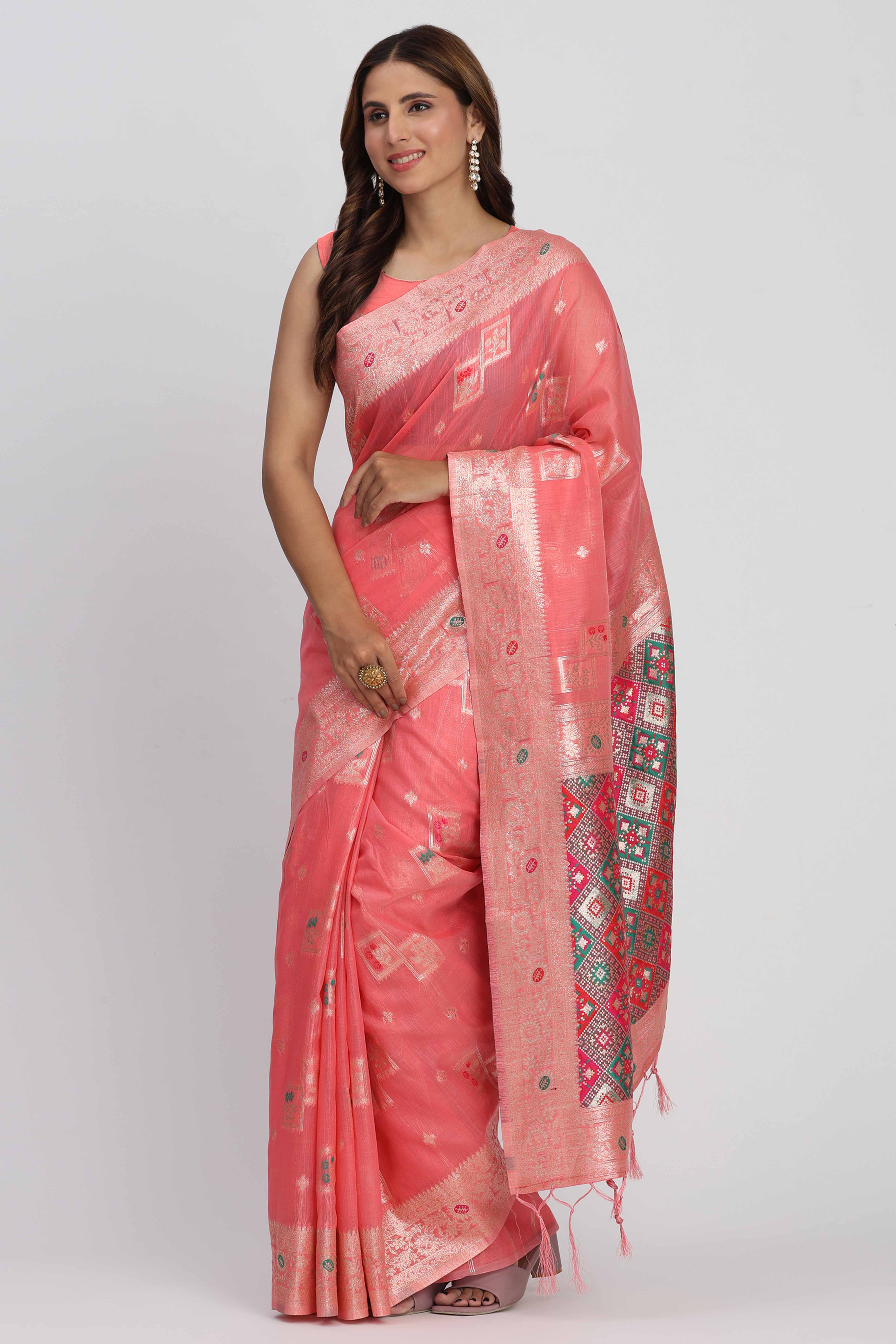 Floral Zari Weaving Brings Regal Beauty To This Coral Pink Linen Cotton Saree With Tassel Accents