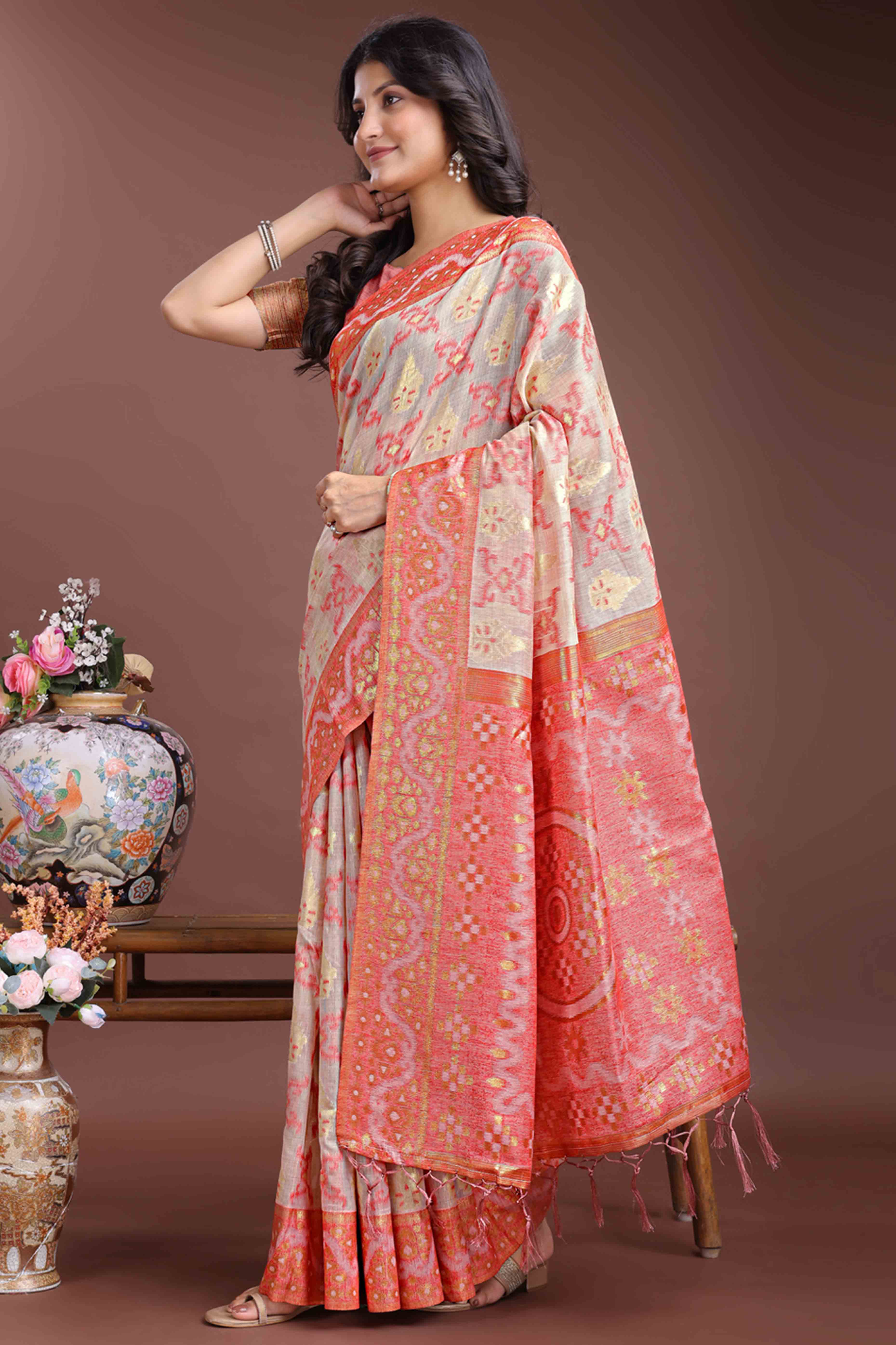 Exquisite Peach Traditional Ikkat Style Zari Weaving Cotton Blend Saree with Delicate Tassels