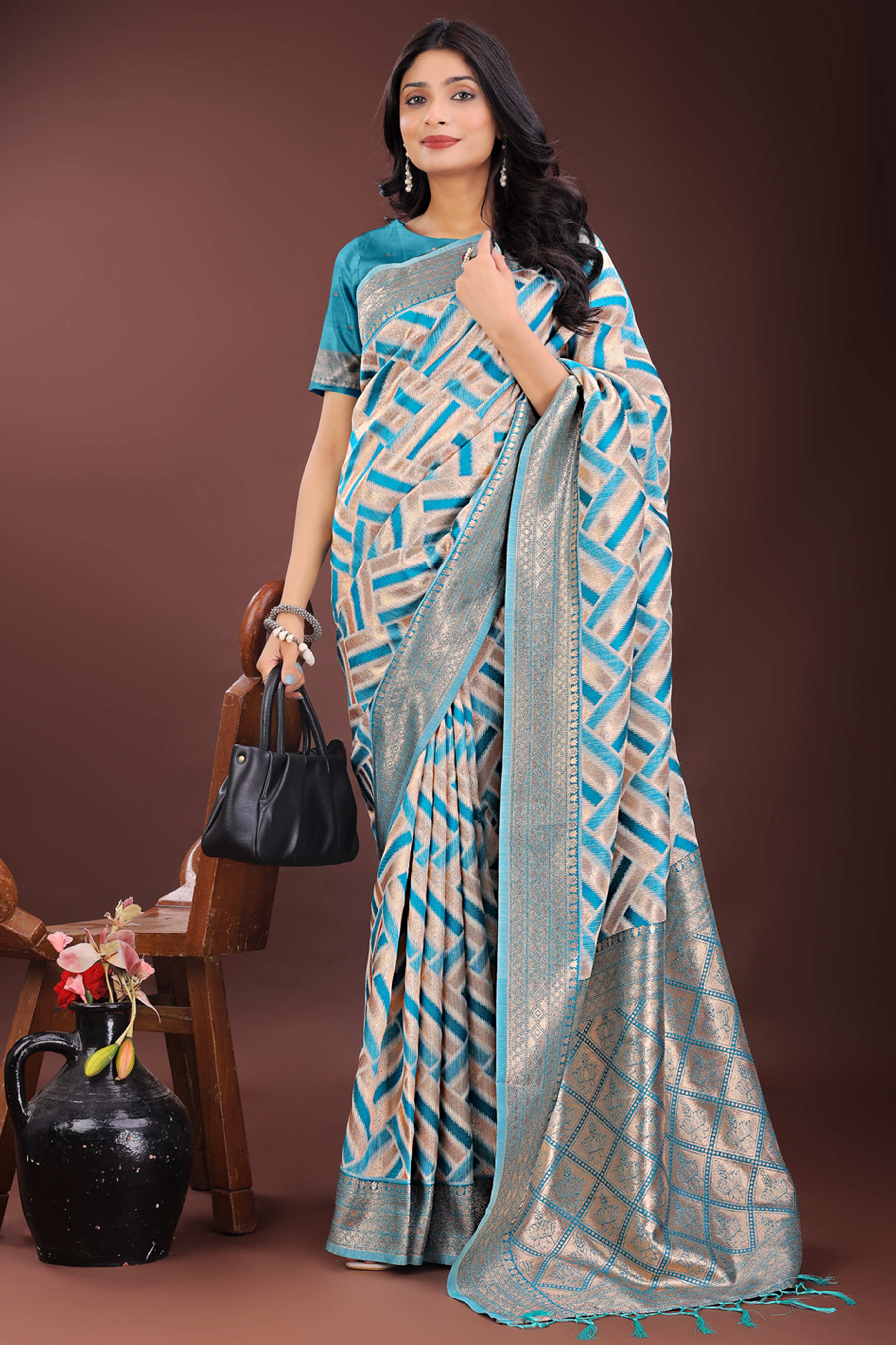 Teal Saree with Zari Woven Geometric Motifs and Graceful Tassel Accents