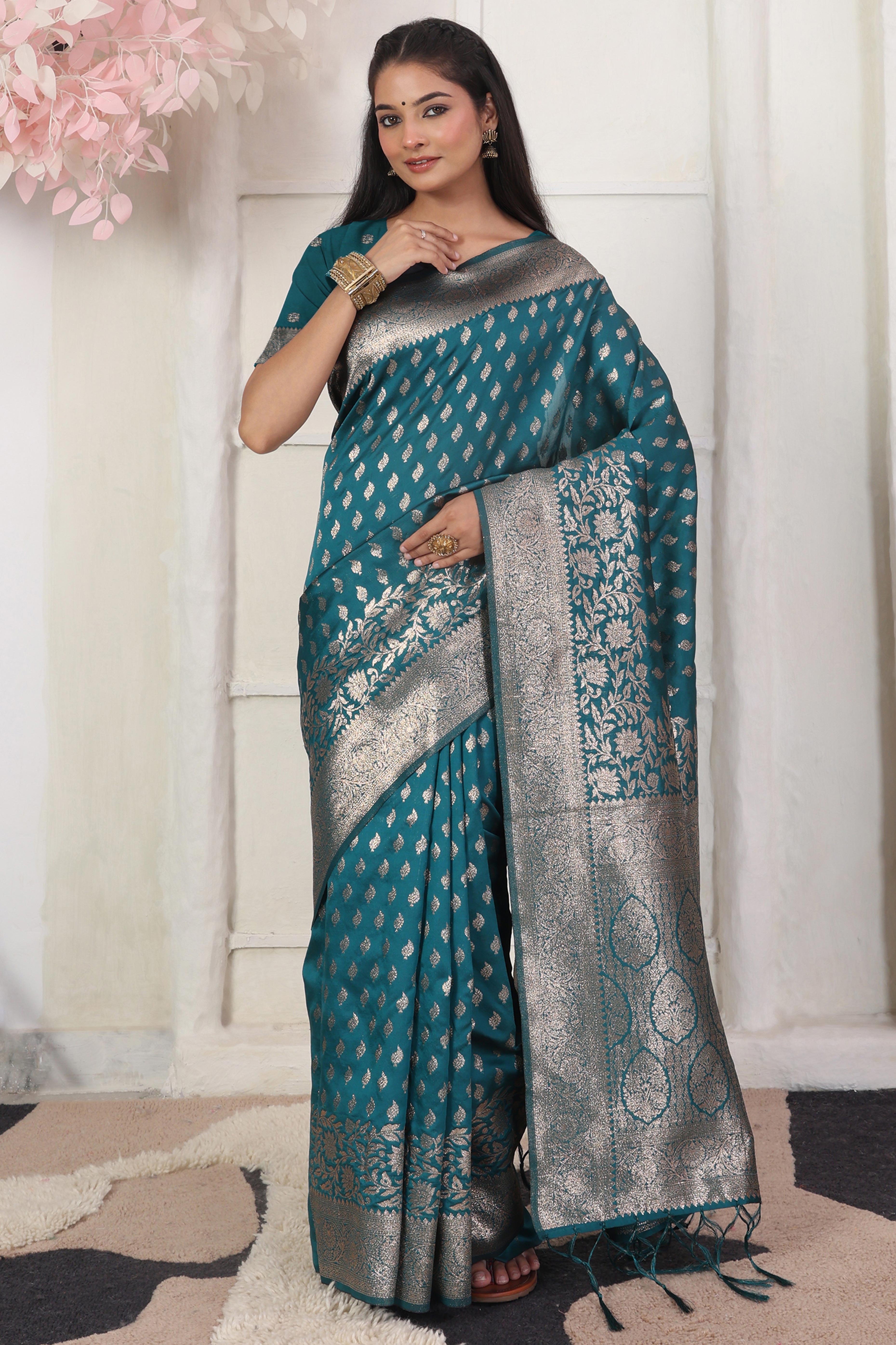 Rama Blue Traditional Lichi Silk Blend Saree Enhanced With Floral Zari Weaving & Tassel Pallu
