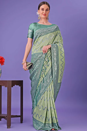 Light Green Lichi Cotton Silk Saree Adorned With Floral Zari Weave & Tassels