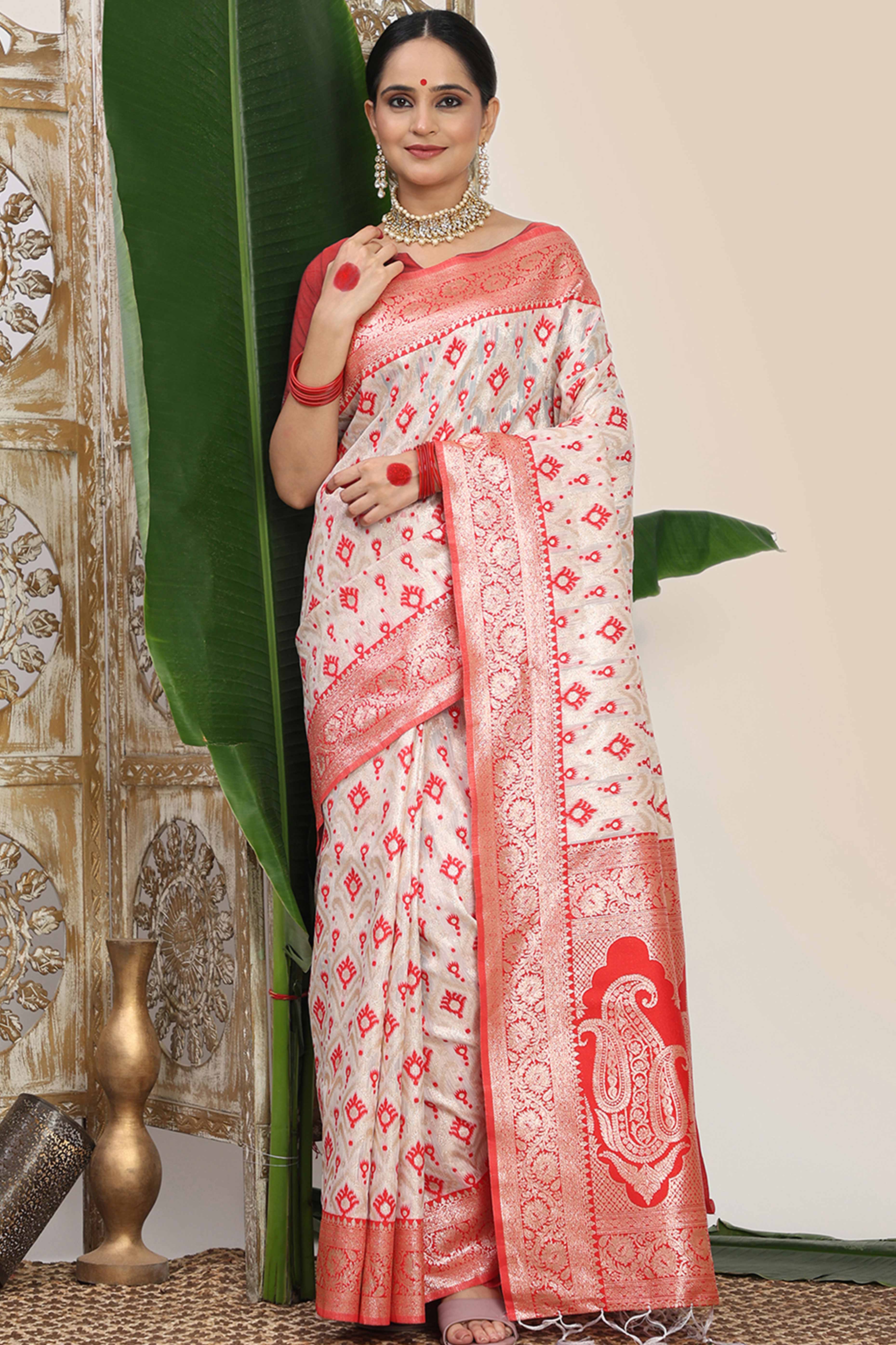 White & Red Linen Cotton Saree Accented With Rich Zari Weaving And A Decorative Tassel Pallu