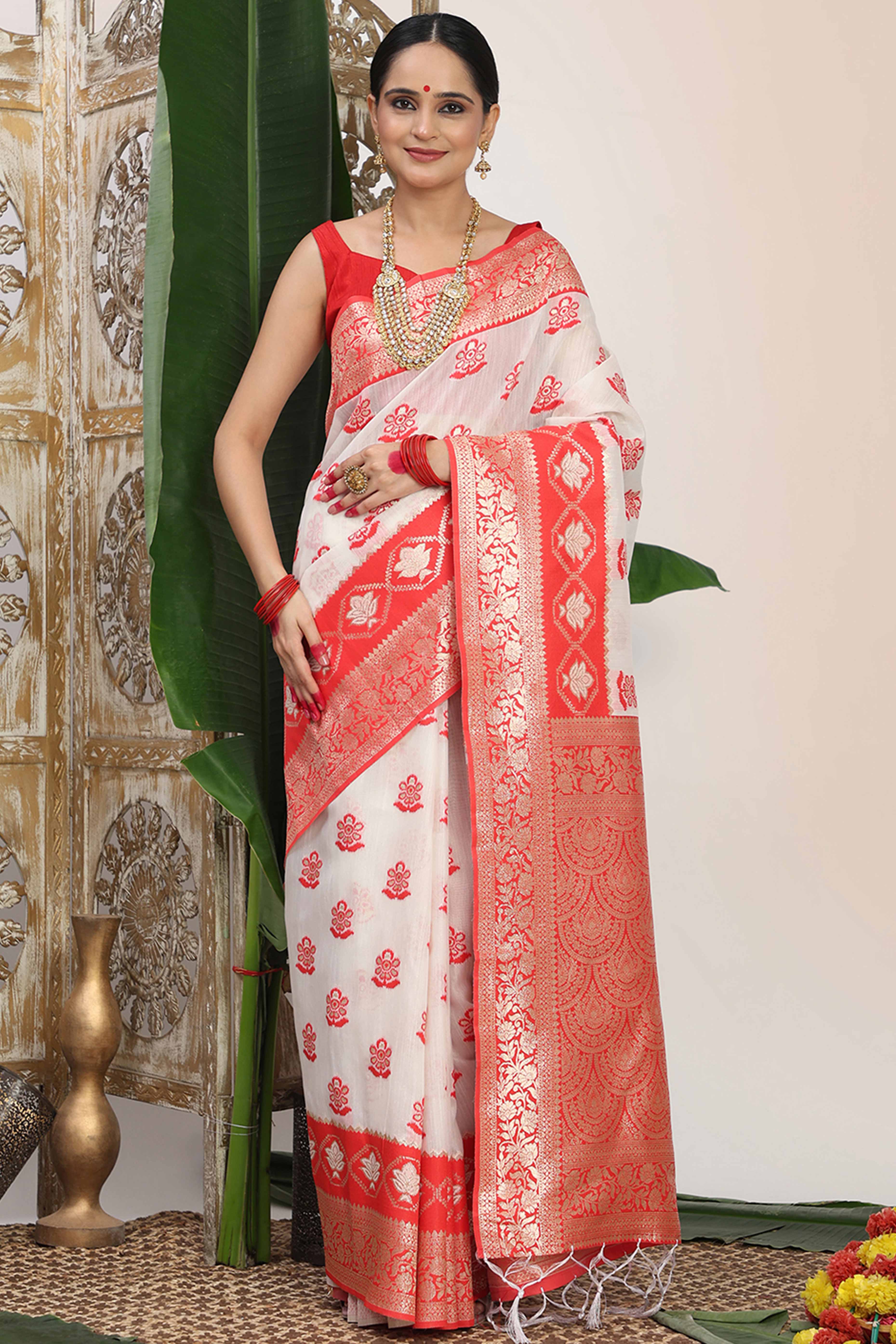 Chic White & Red Saree In Linen Cotton Flaunting Traditional Zari Weaving And A Tasselled Edge