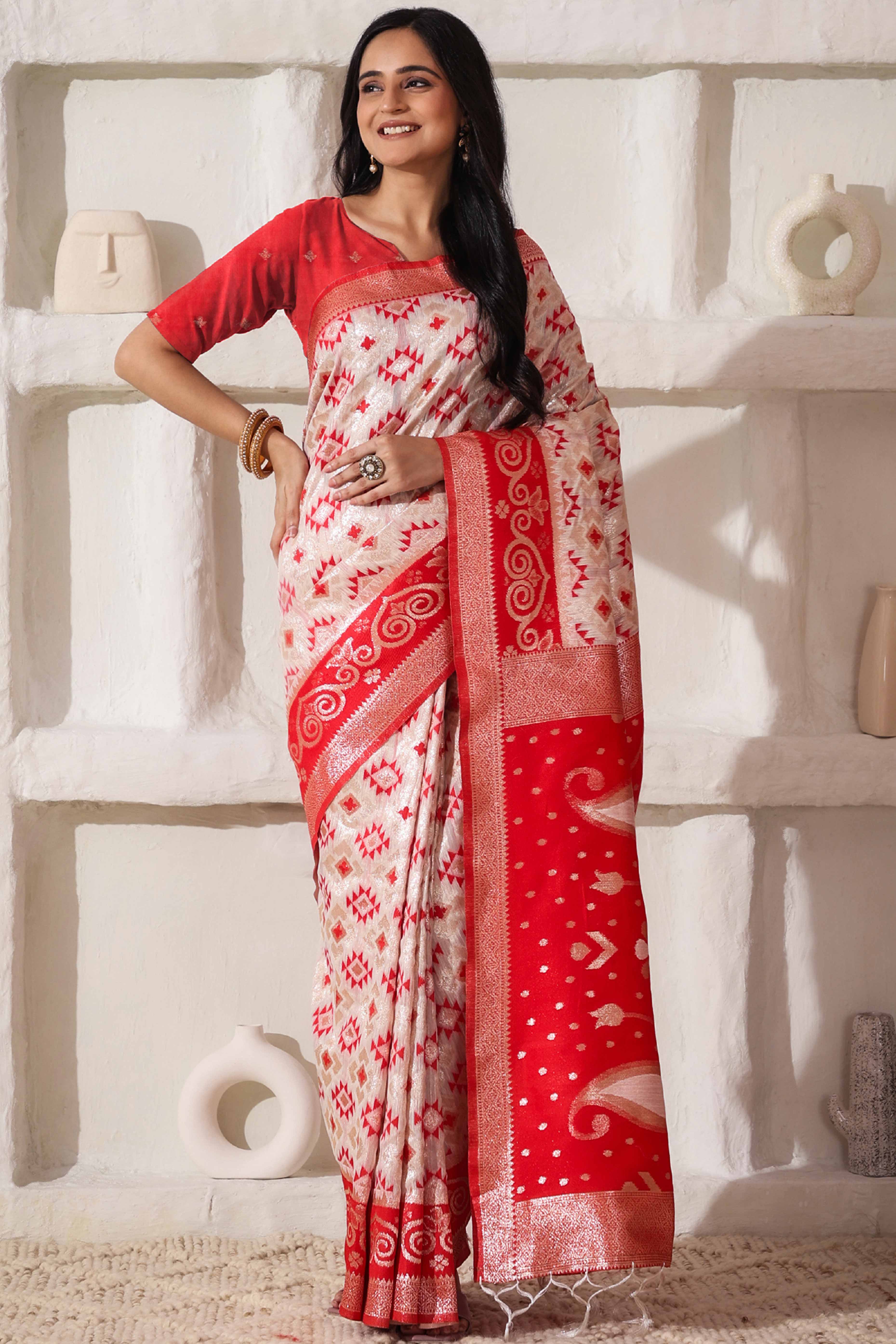 White & Red Linen Cotton Saree Featuring Fine Zari Weaving And A Tasselled Finish