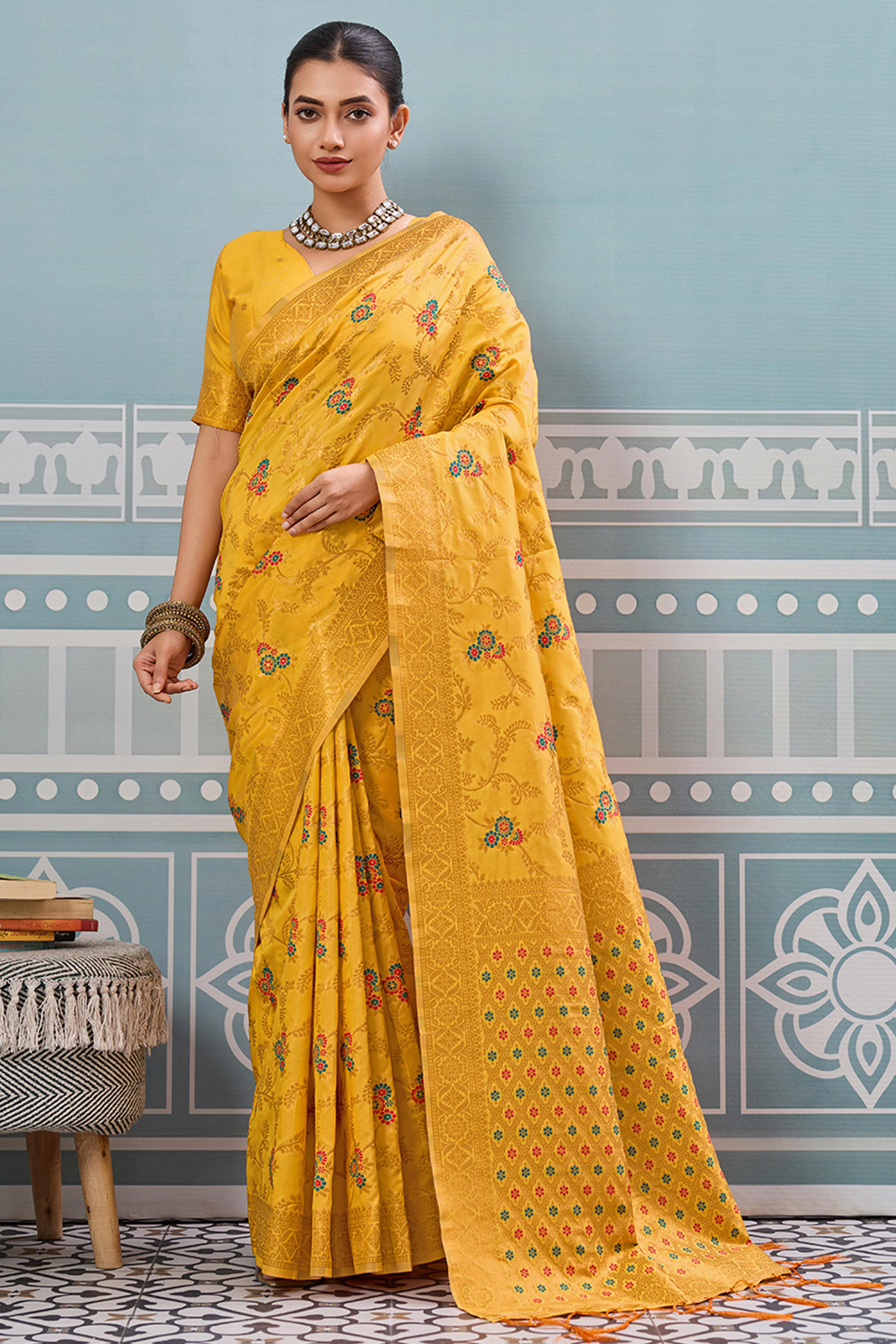 Majestic Bloom Yellow Floral Zari Weaving Silk Blend Saree With Elegant Tassel Pallu