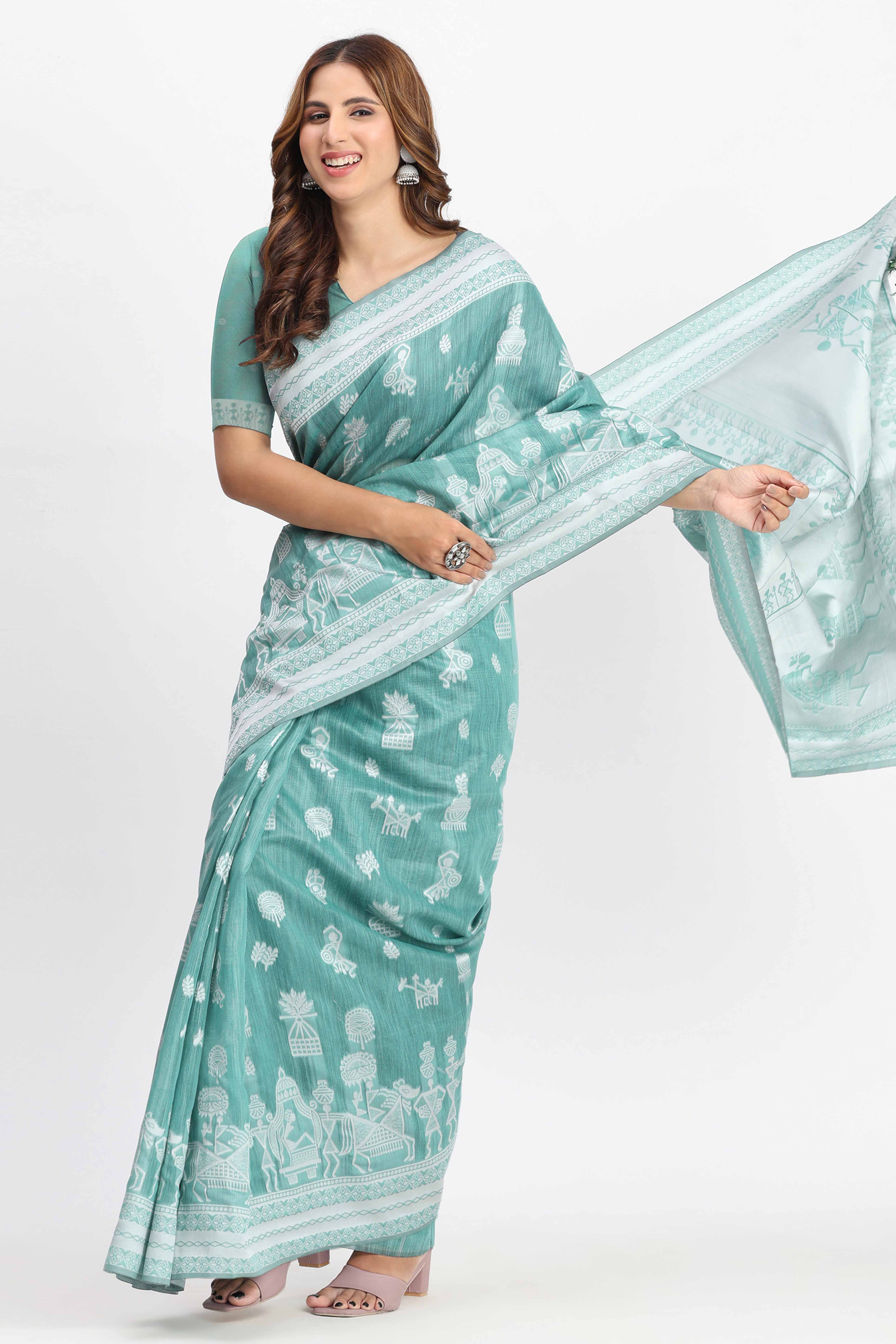 Pastel Sea Green Linen Cotton Saree Showcasing Warli Motifs In Zari Weaving With Tassel Pallu