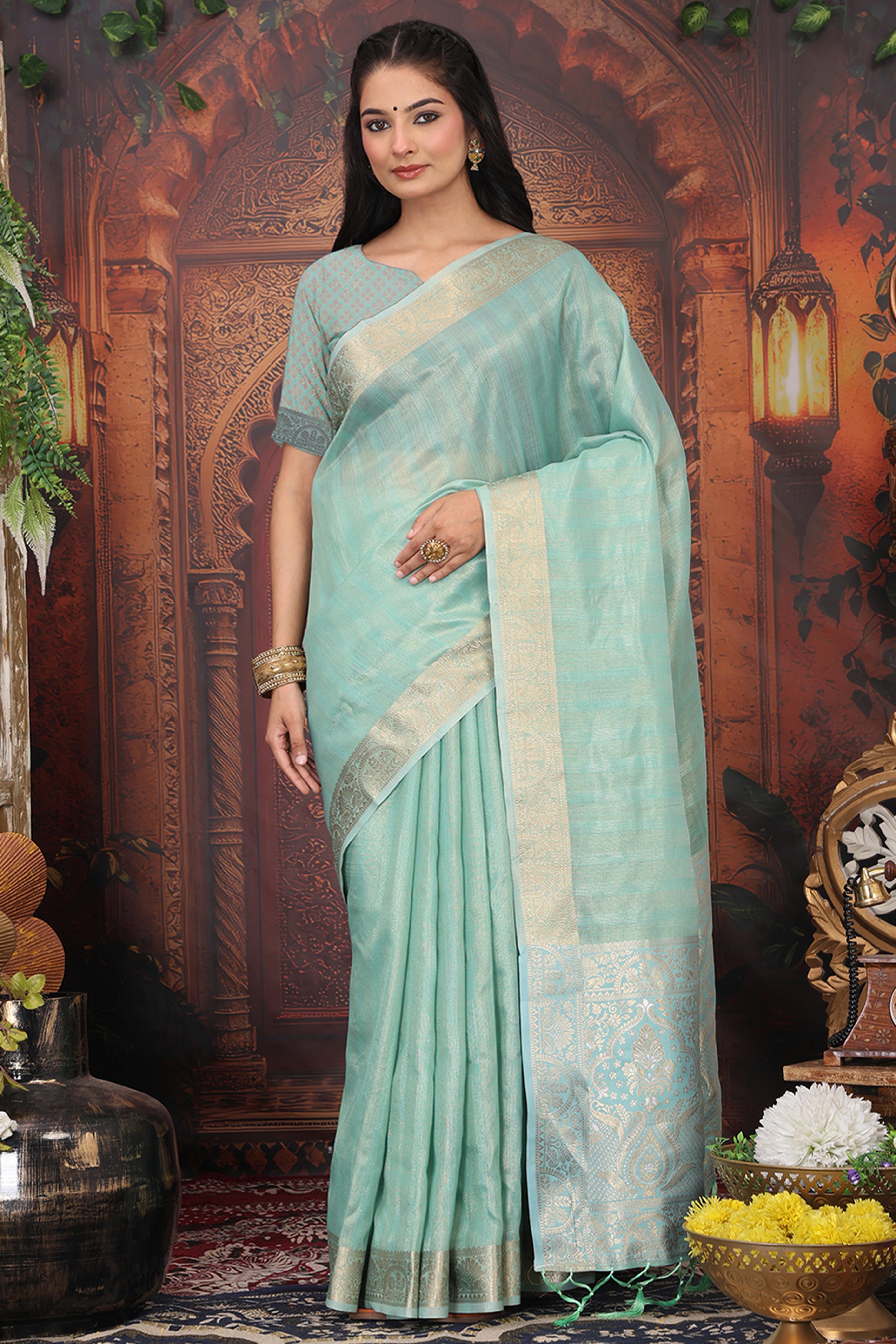 Turquoise Organza Saree Adorned With Floral Zari Weaving & Graceful Tassel Pallu
